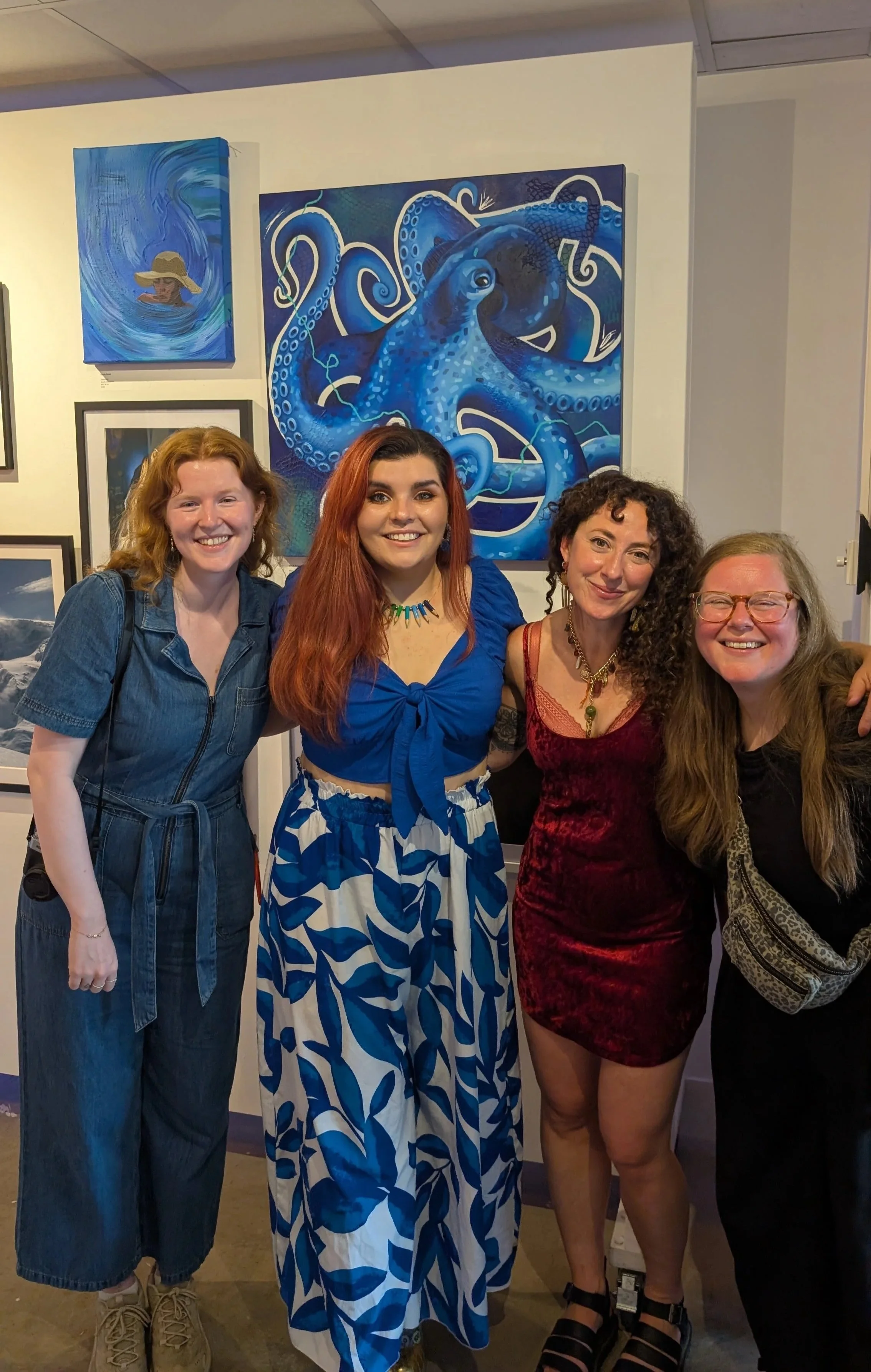Guildford artist Sam B. Kennedy with the gallery team at New House Art Space in Guildford during the Out of the Blue art exhibition.