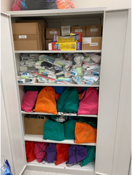 Our cabinet full of donated supplies