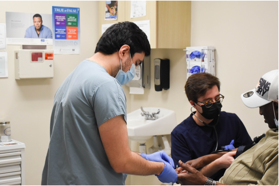 Volunteers at HOMES Clinic doing what we do best