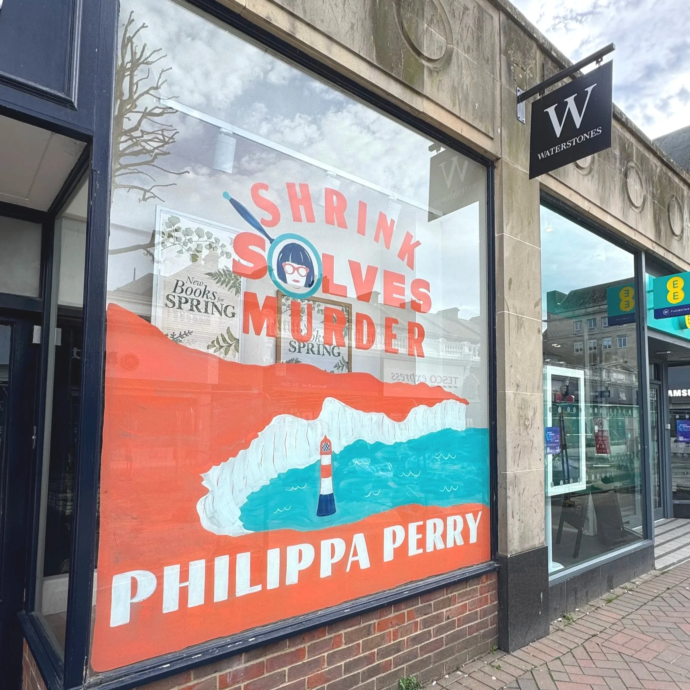 Bookshop window mural of the book cover design