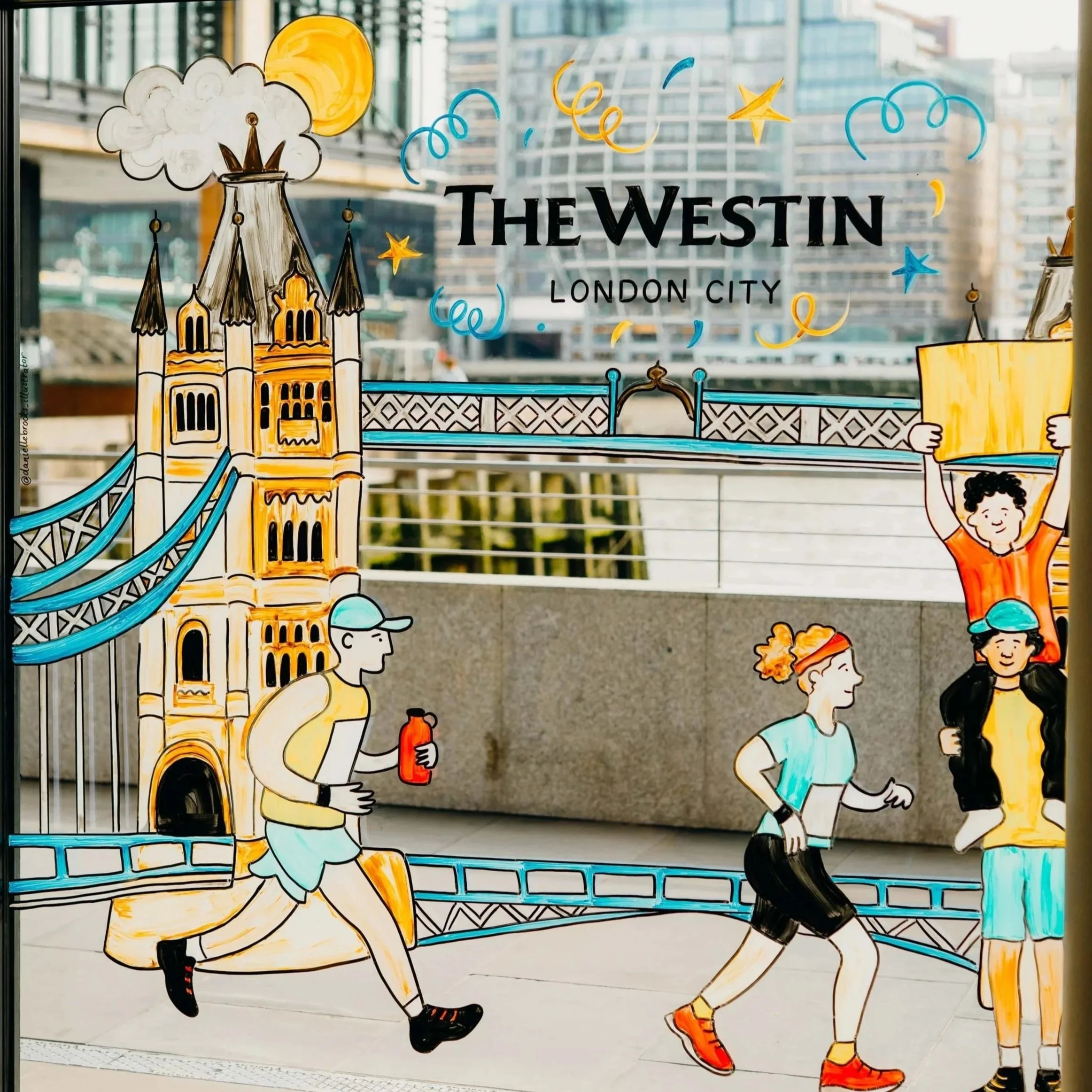 London Marathon window mural showing runners passing Tower Bridge