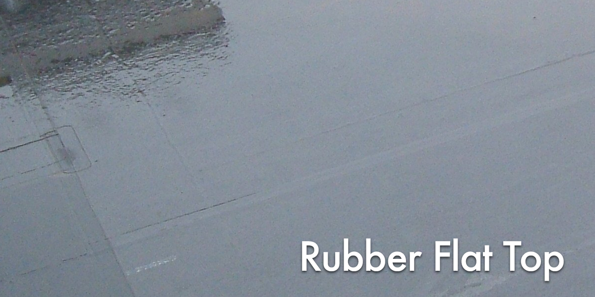 Close-up of a rubber flat top surface with text overlay that says 'Rubber Flat Top'