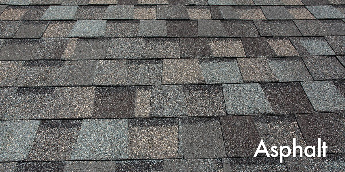 Close-up of asphalt roof shingles in various shades of gray and black.