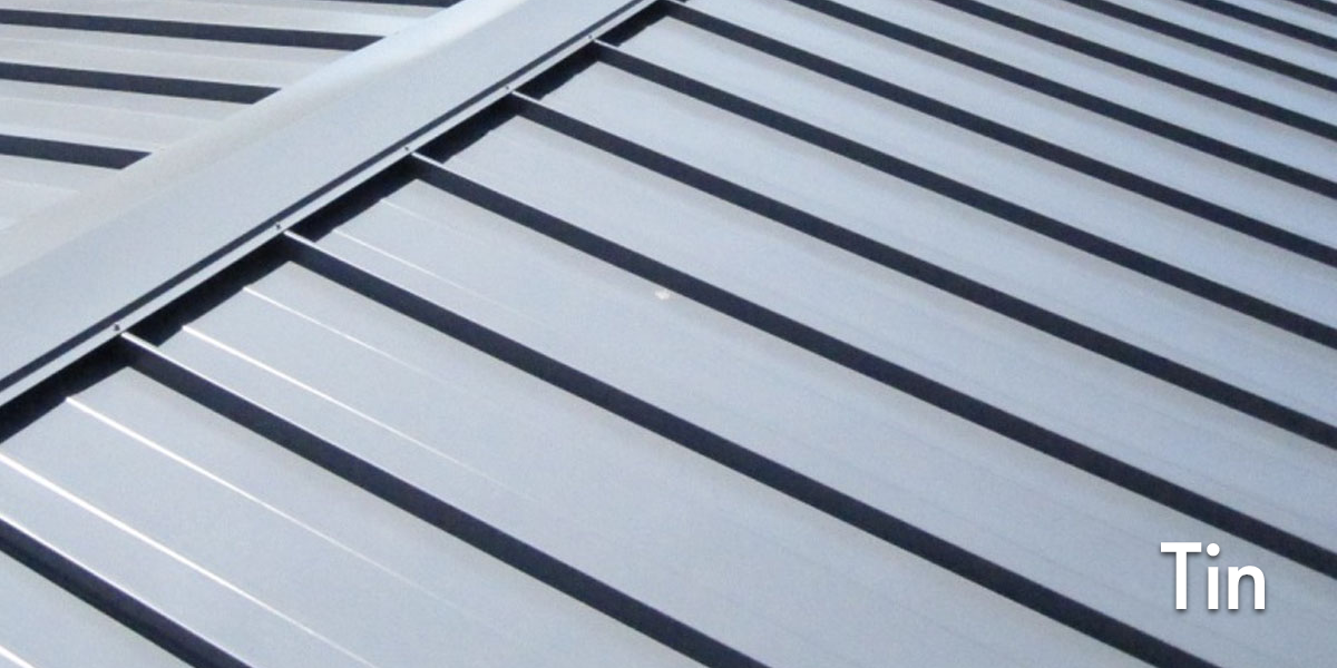 Close-up of a metal tin roof with overlapping panels