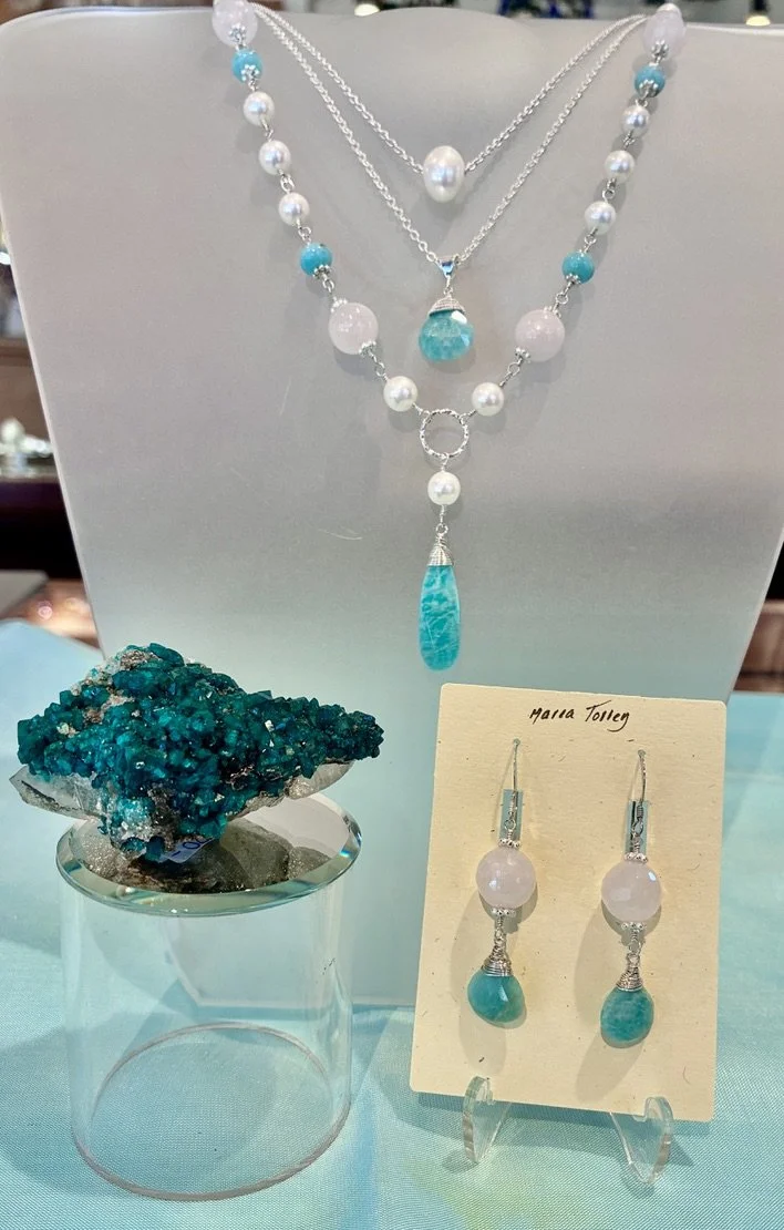 New designs by exclusive local Shady Lane jeweler, Maria Torrey, featuring Pearis and moonstones the birthstones for June! Showcased with a stunning  chrome Diopside specimen. 