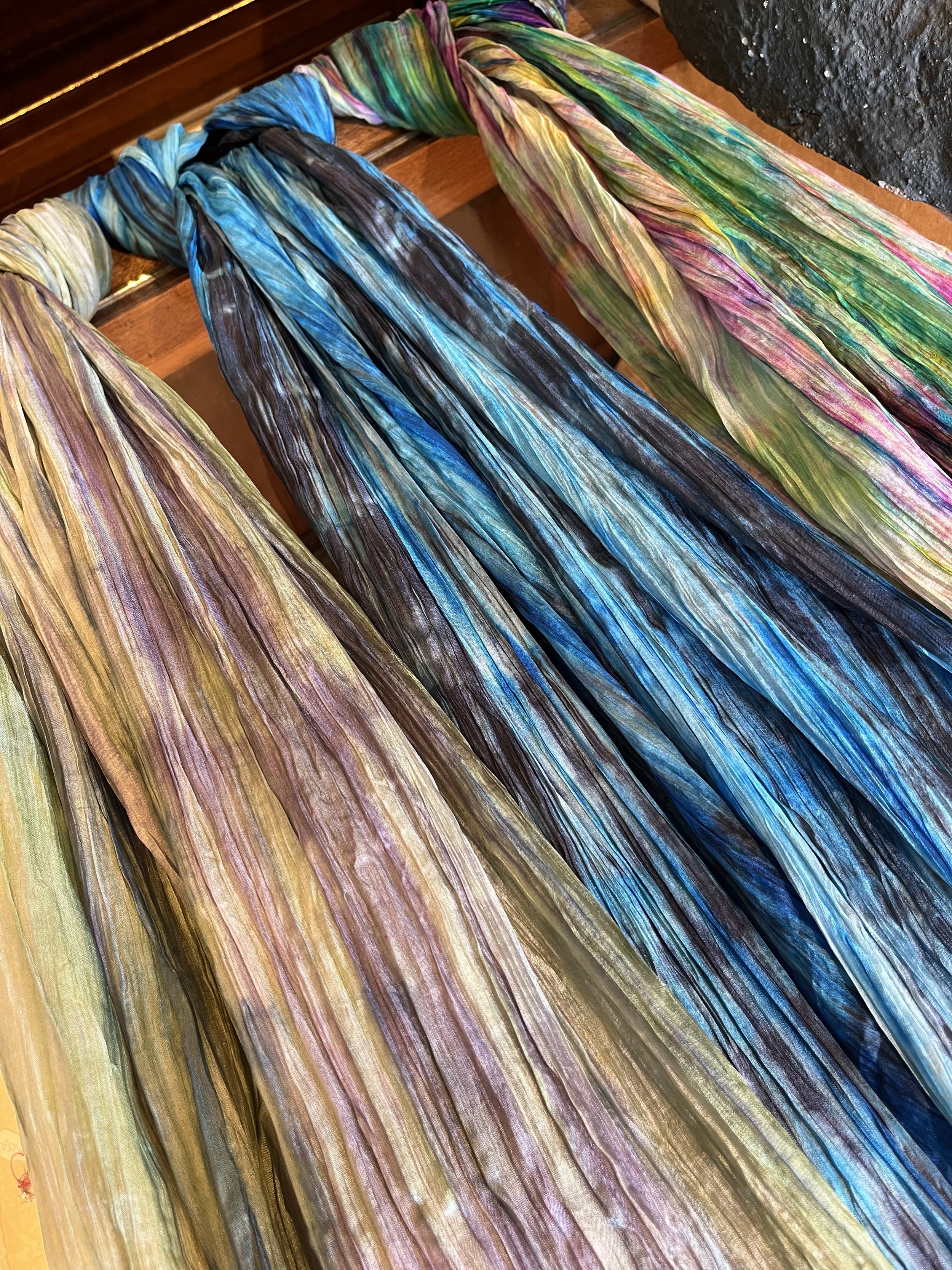 Just arrived this Saturday more of our extremely popular hand dyed silk scarves. Thery are called waterfall scarves as they cascade with blended colors in a crinkled silk effect. Perfect for a colorful light weight
spring accessory.