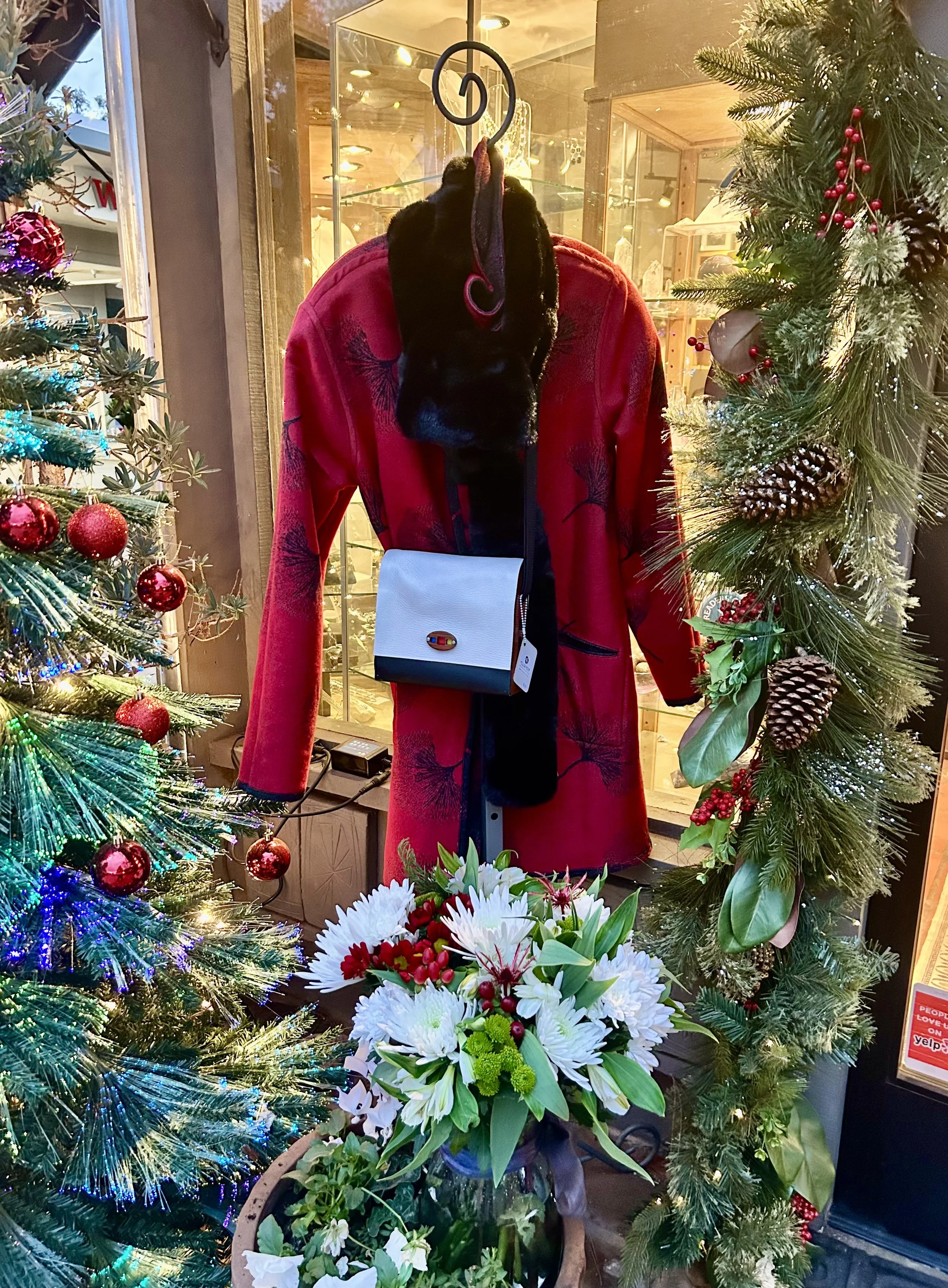 Black and Red reversible coat with pockets featuring a ginkgo pattern on both sides and also pockets on both sides!  Accessorized by a hand crafted leather and wood purse by Mt. View artisan, Kathy Bonte