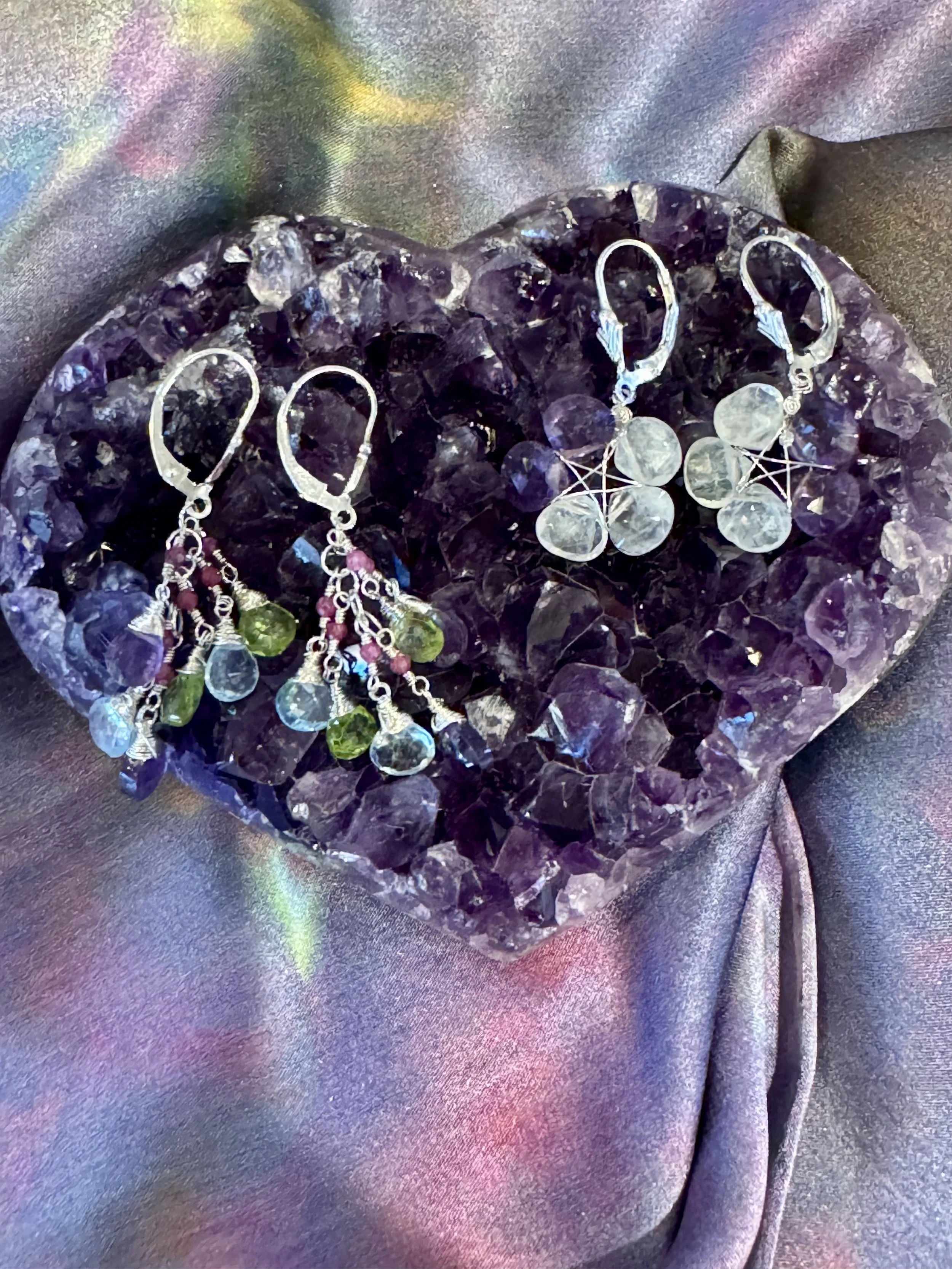 Looking for elegant earrings as a gift or for yourself? Our local  artisan, Maria Torrey, is showcasing these earrings on one of our new small amethyst hearts! She uses impeccable natural gemstones and her delicate wire wrap tecnique is beyond amazin