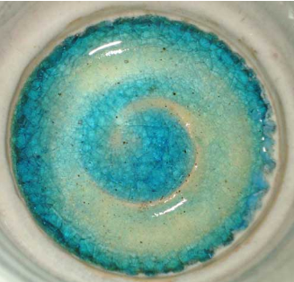 Figure 1: 
A small bowl with Red Chunky Terrazzo size 2 from Lakeside Pottery fired to cone 6 (10). Terrazzo are bits of glass often used in decorative concrete. 
