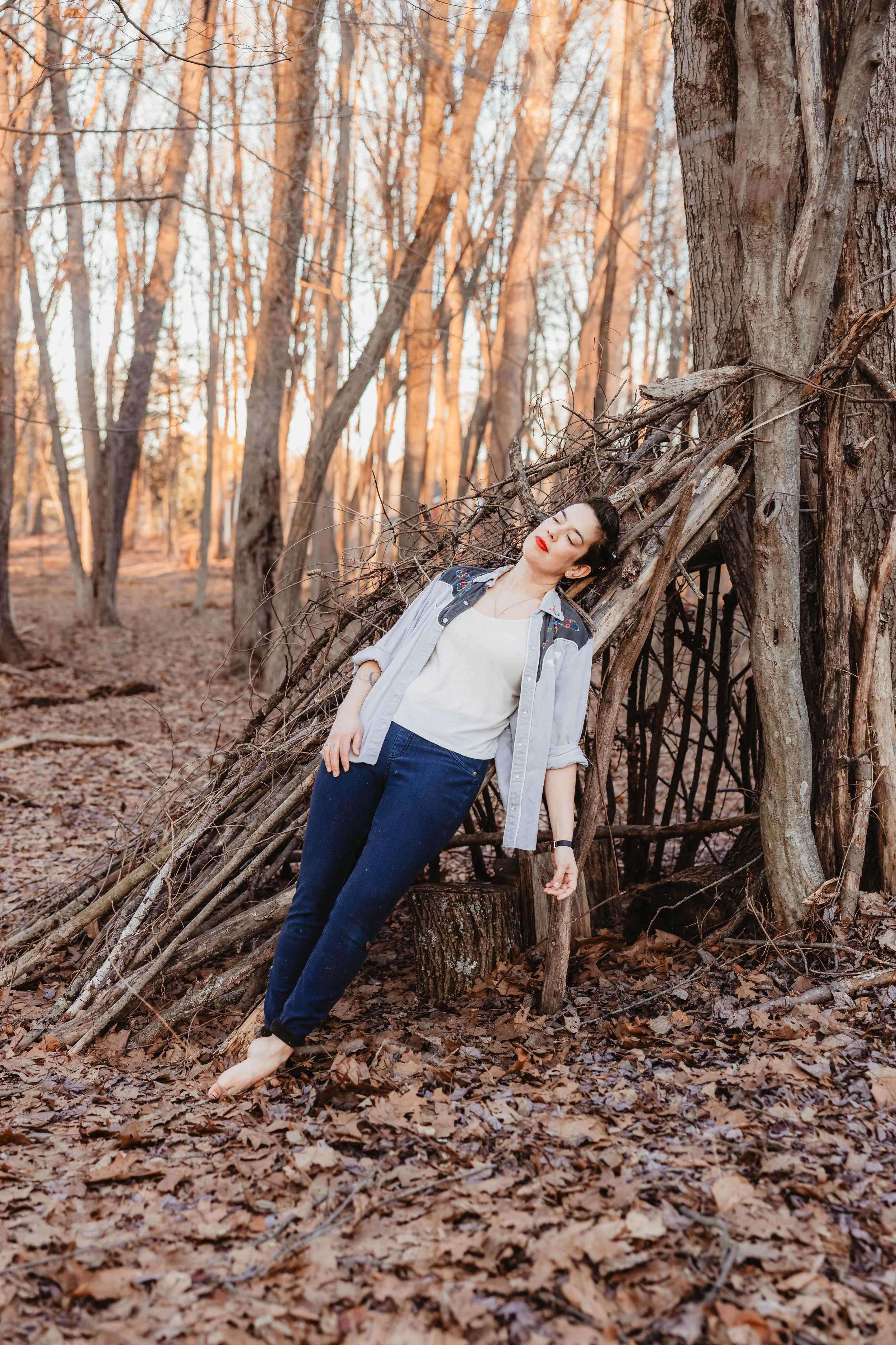An image of Hudson Valley musician, Hen in the Foxhouse, aka Elena Krell, in the woods in Rosendale, NY.