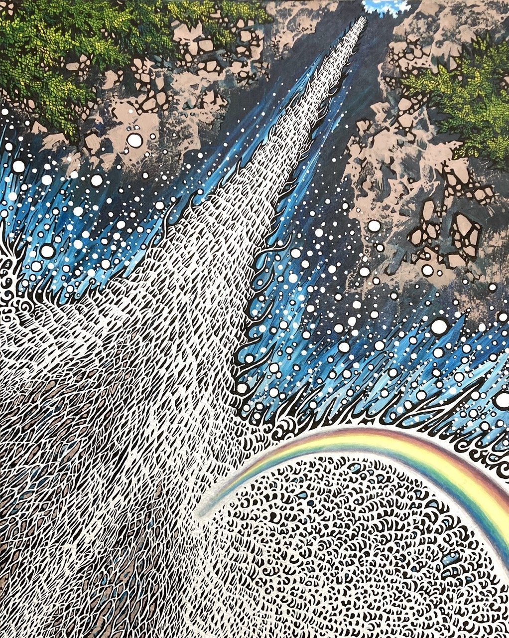 A rainbow over  a waterfall 5