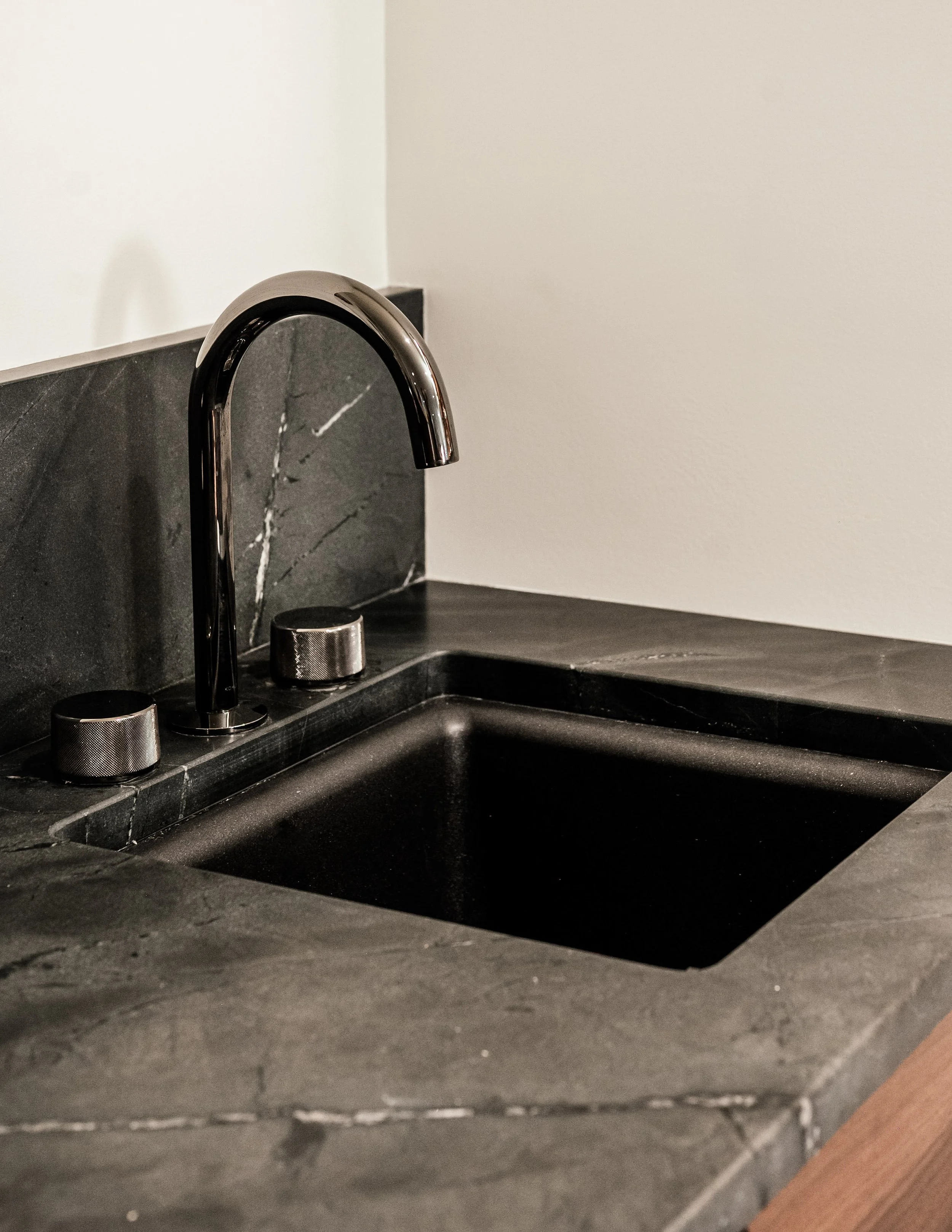 Black Negresco granite bar sink with black sink and brushed black fixtures