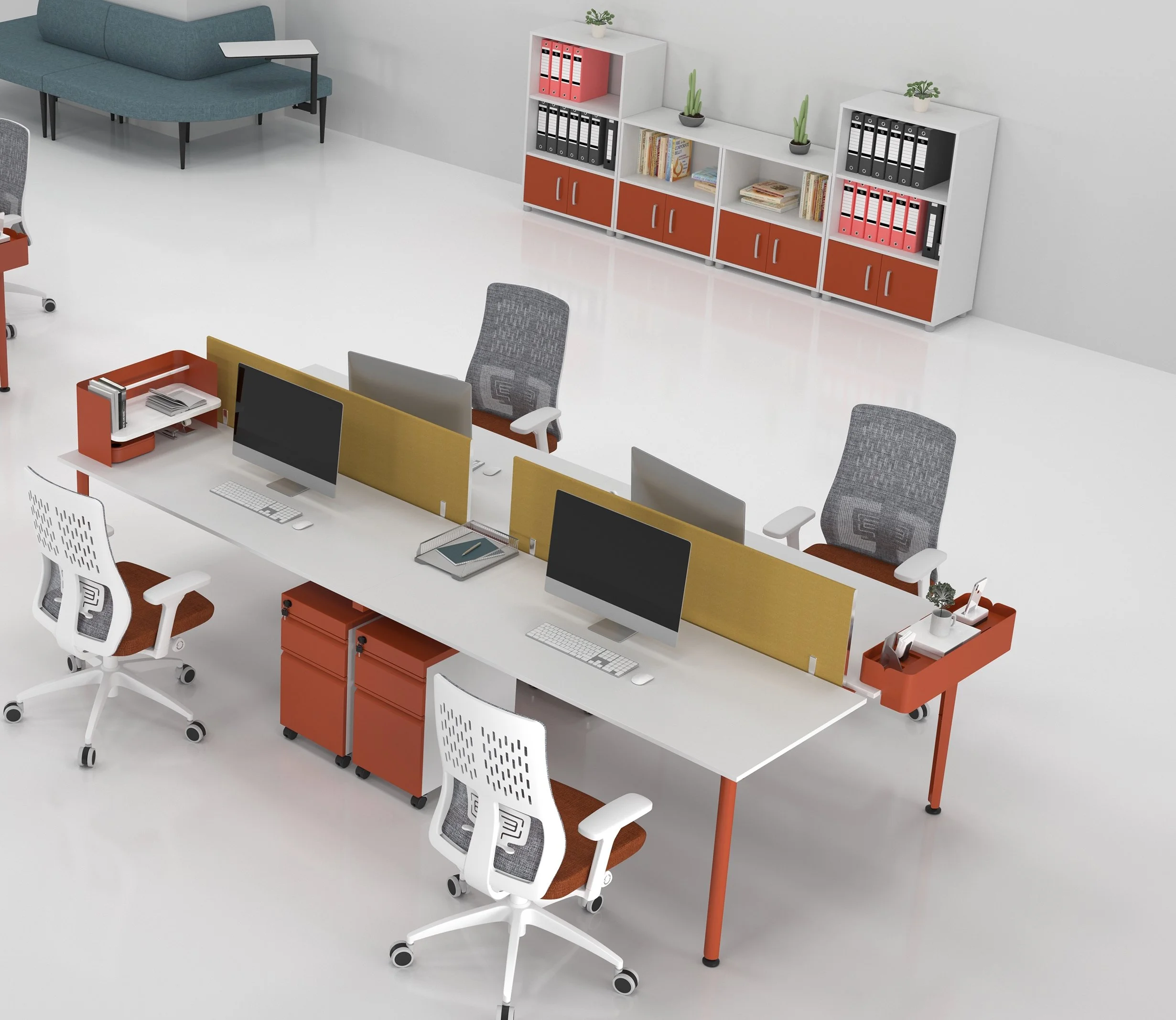 Modern office workspace with white desks, computer monitors, office chairs, and a white shelf with binders and books in the background.