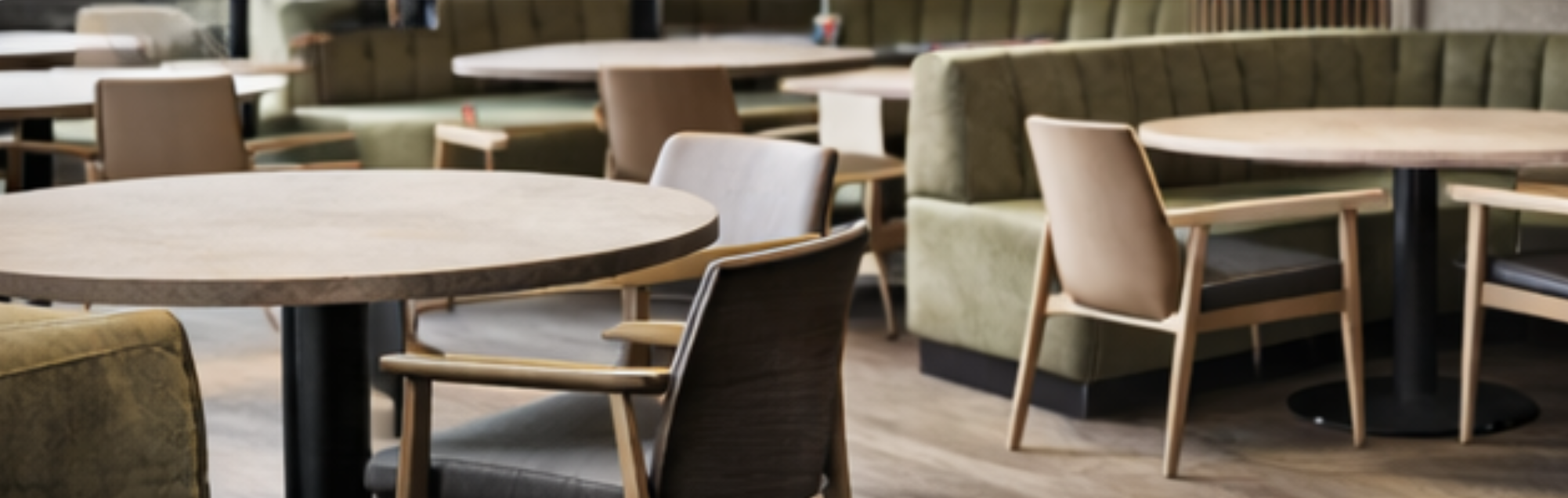 Commercial restaurant furniture with dining tables, chairs, and booth seating for hospitality spaces