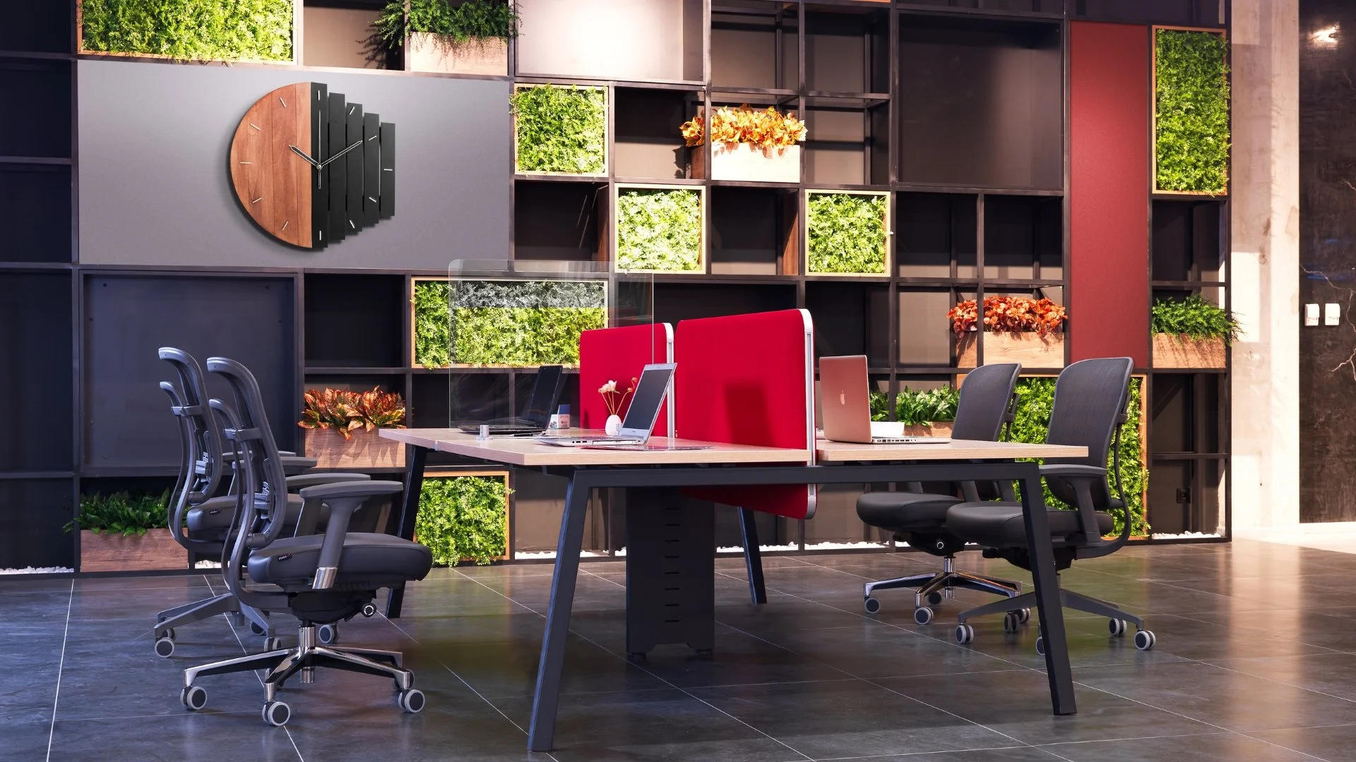 Modern office conference room with a wooden table, black office chairs, and a green wall with various potted plants, a large wall clock, and colorful decor.