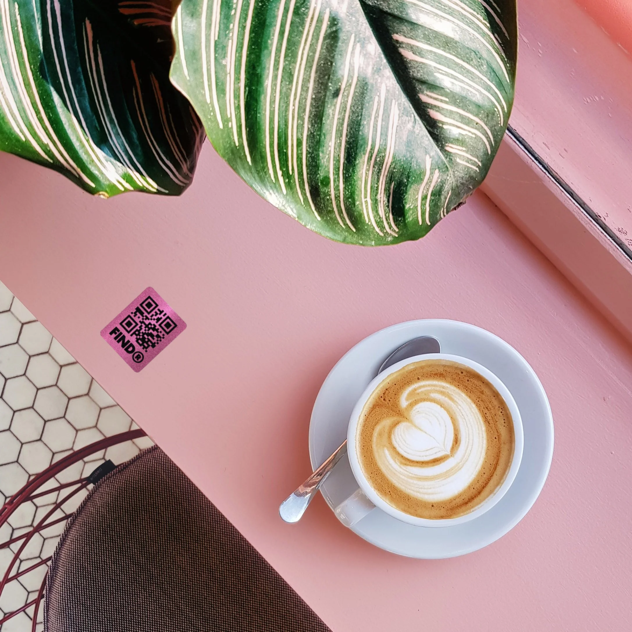 FindR QR code sticker on a coffee counter top