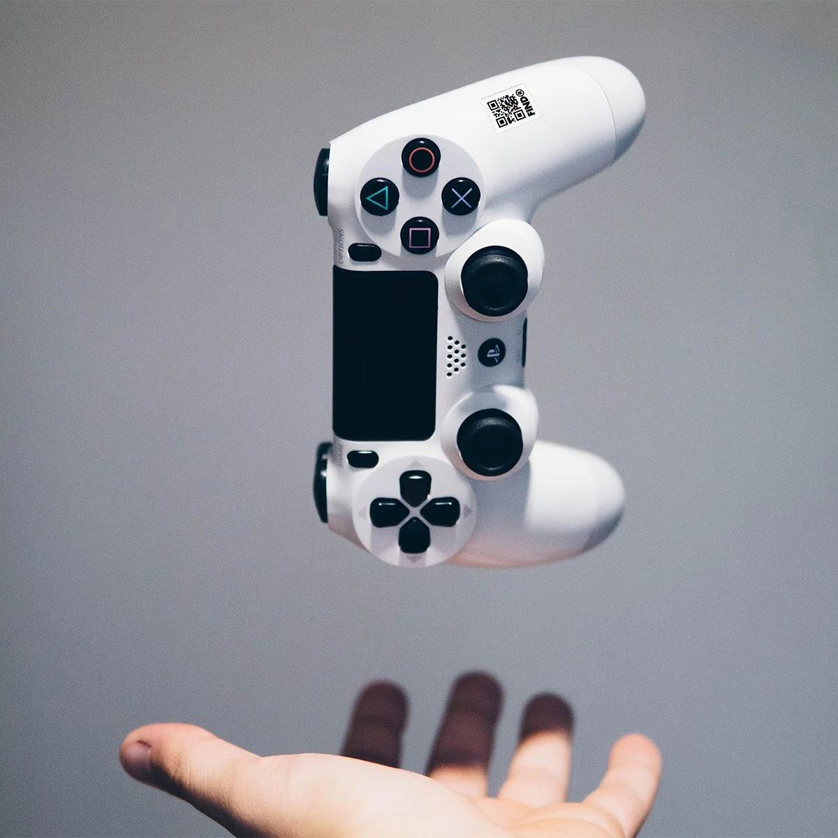 FindR QR code sticker on a game controler