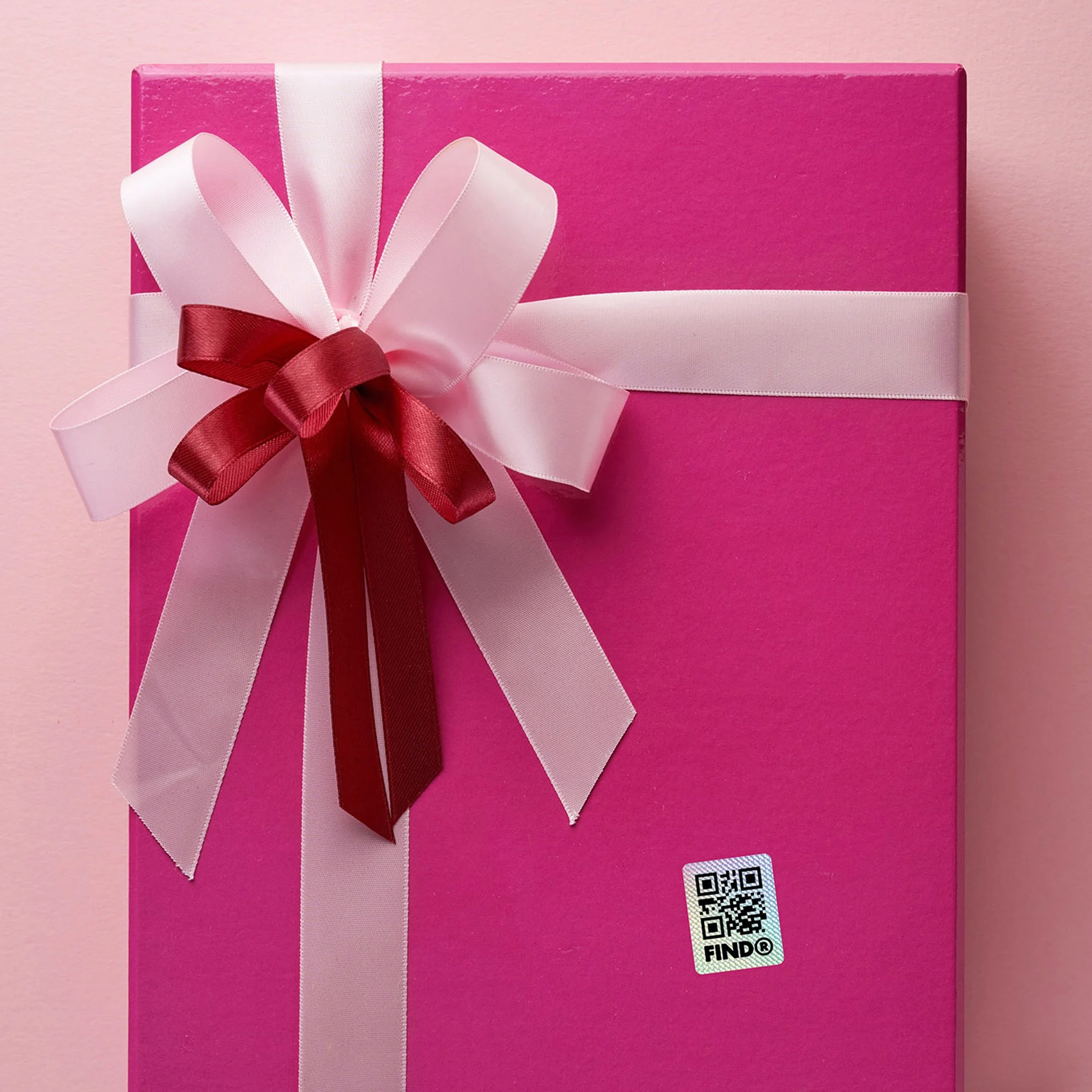 FindR QR code sticker on a pink gift