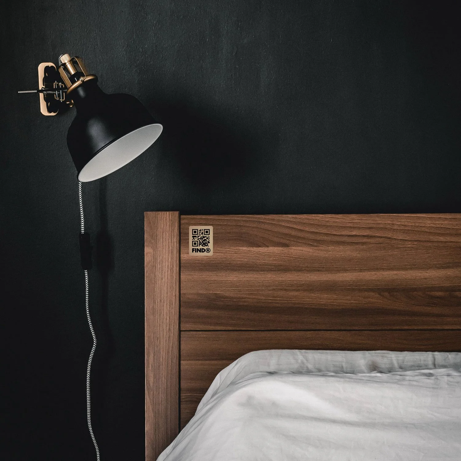 FindR QR code sticker on a bed frame