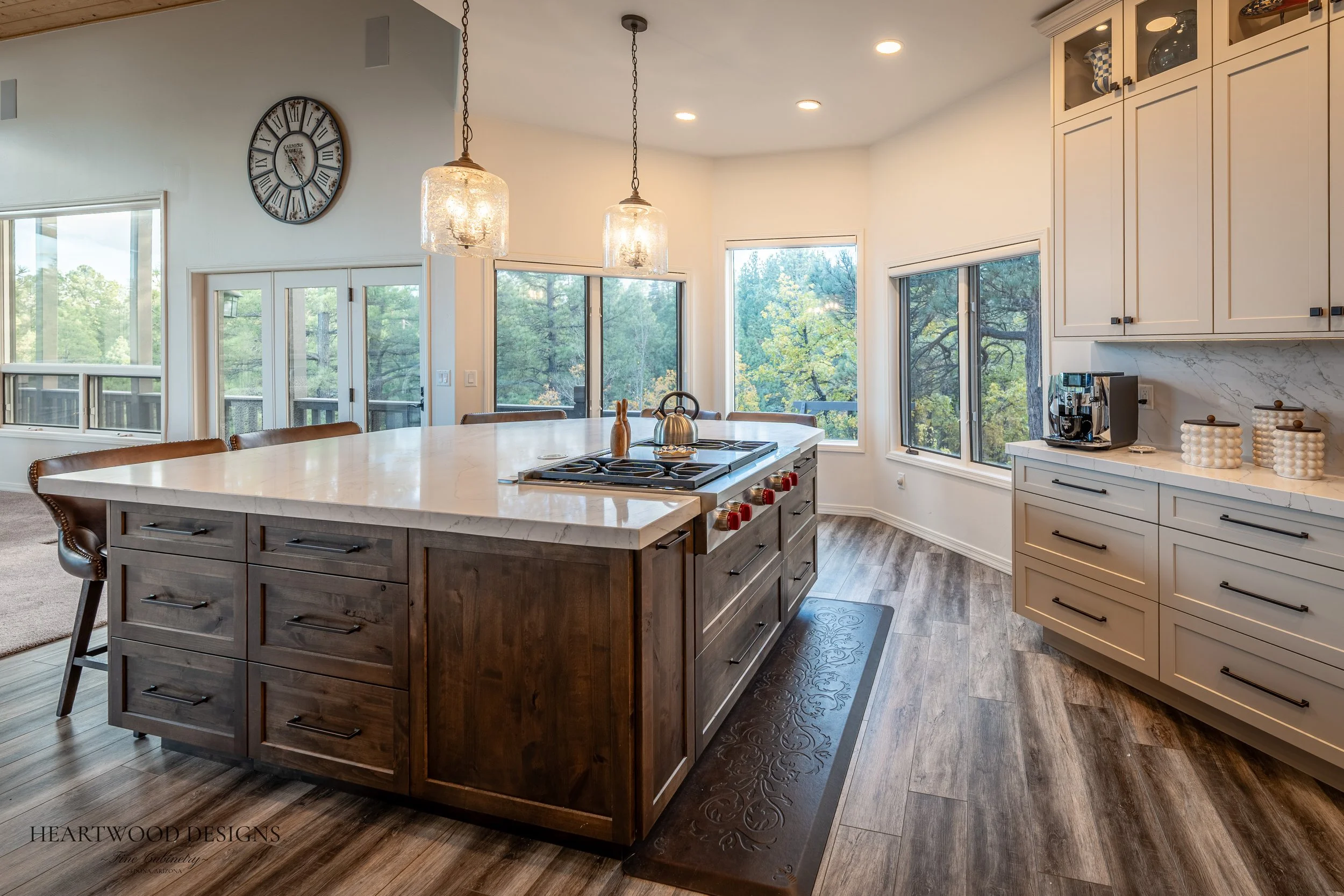 Dark stained knotty alder kitchen island with white painted shaker cabinets in Forest Highlands, Flagstaff AZ
