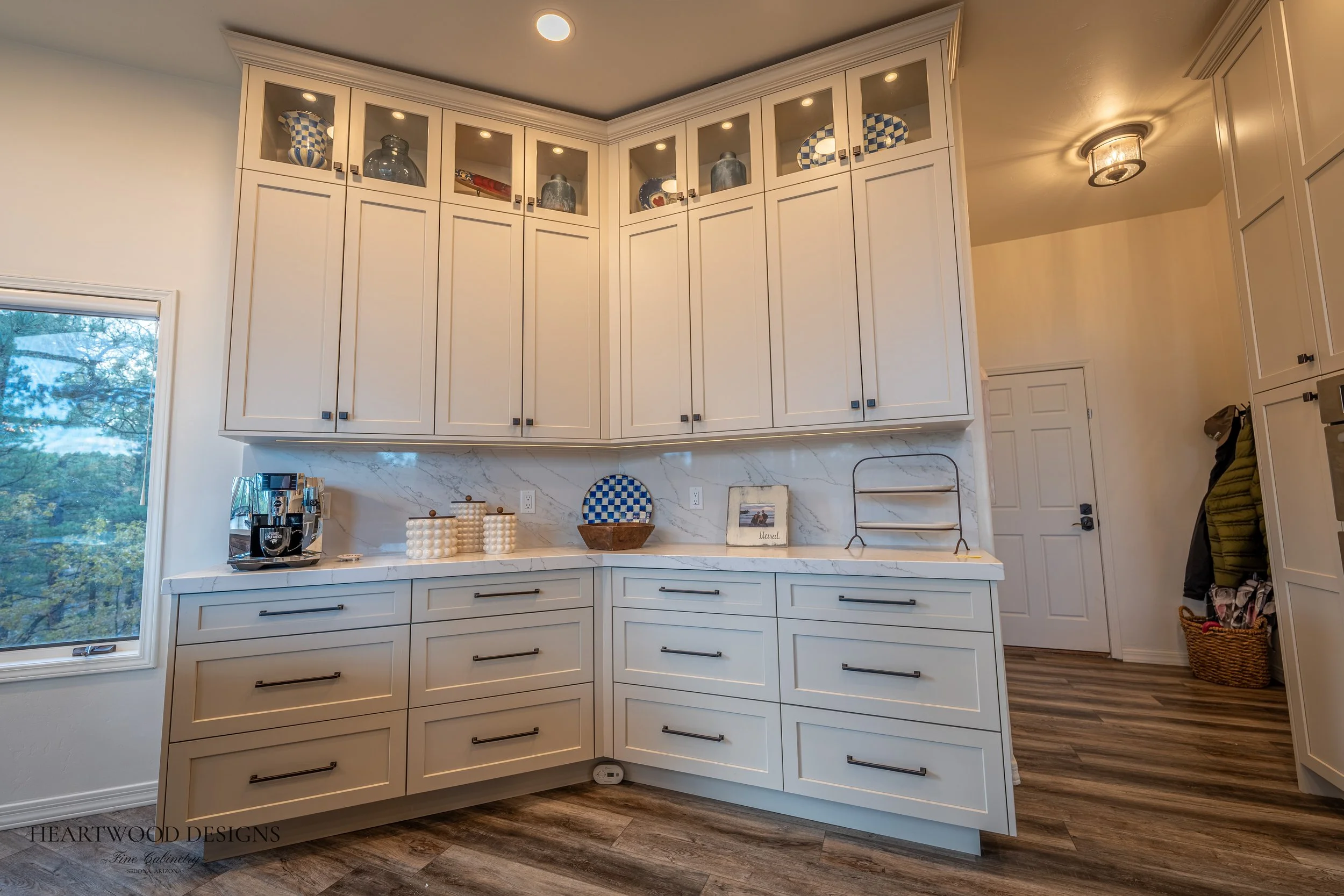 Dark stained knotty alder kitchen island with white painted shaker cabinets in Forest Highlands, Flagstaff AZ