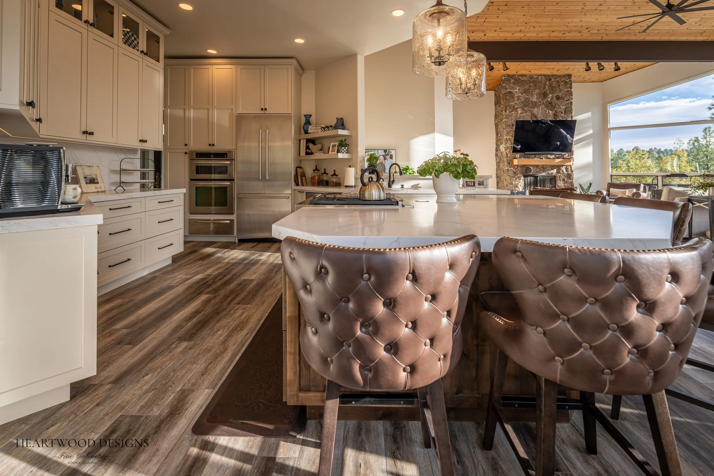 Dark stained knotty alder kitchen island with white painted shaker cabinets in Forest Highlands, Flagstaff AZ