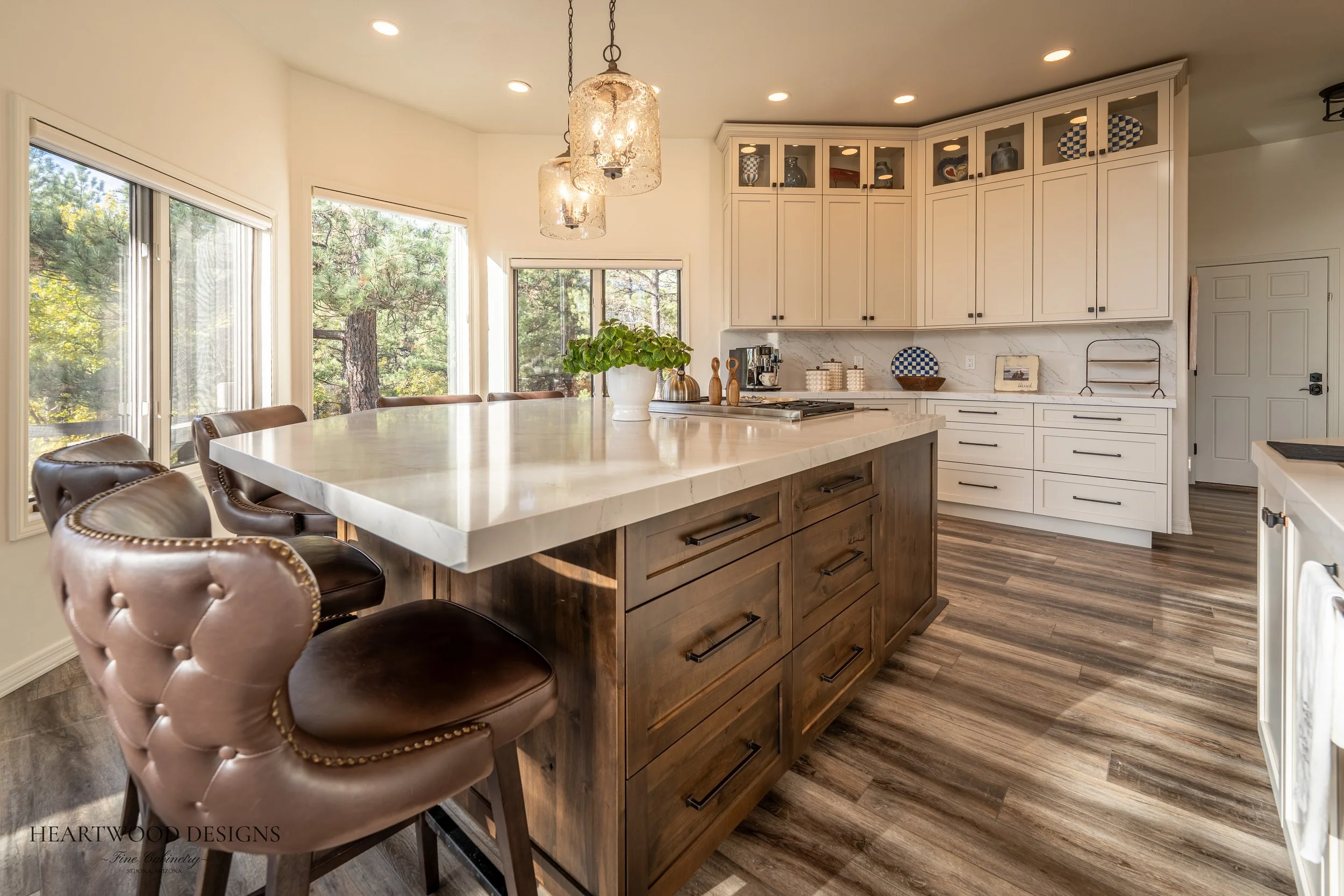 Dark stained knotty alder kitchen island with white painted shaker cabinets in Forest Highlands, Flagstaff AZ