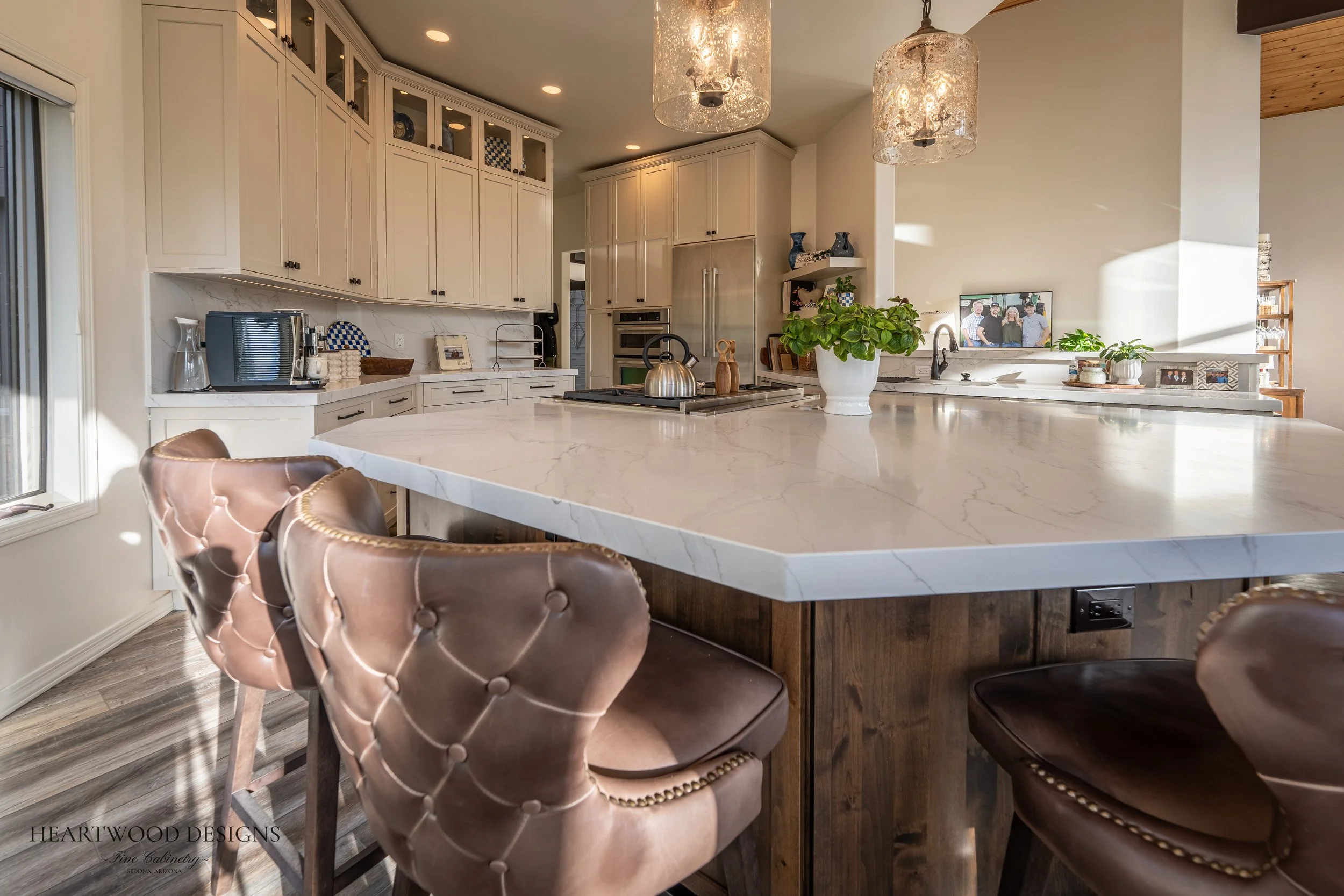 Dark stained knotty alder kitchen island with white painted shaker cabinets in Forest Highlands, Flagstaff AZ