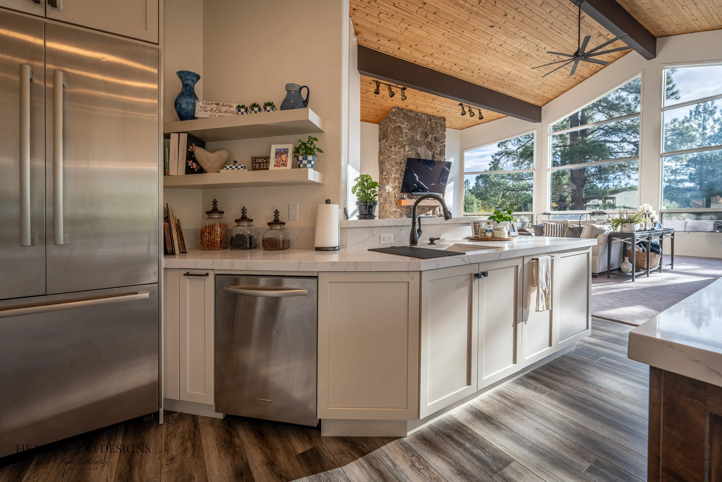 Dark stained knotty alder kitchen island with white painted shaker cabinets in Forest Highlands, Flagstaff AZ