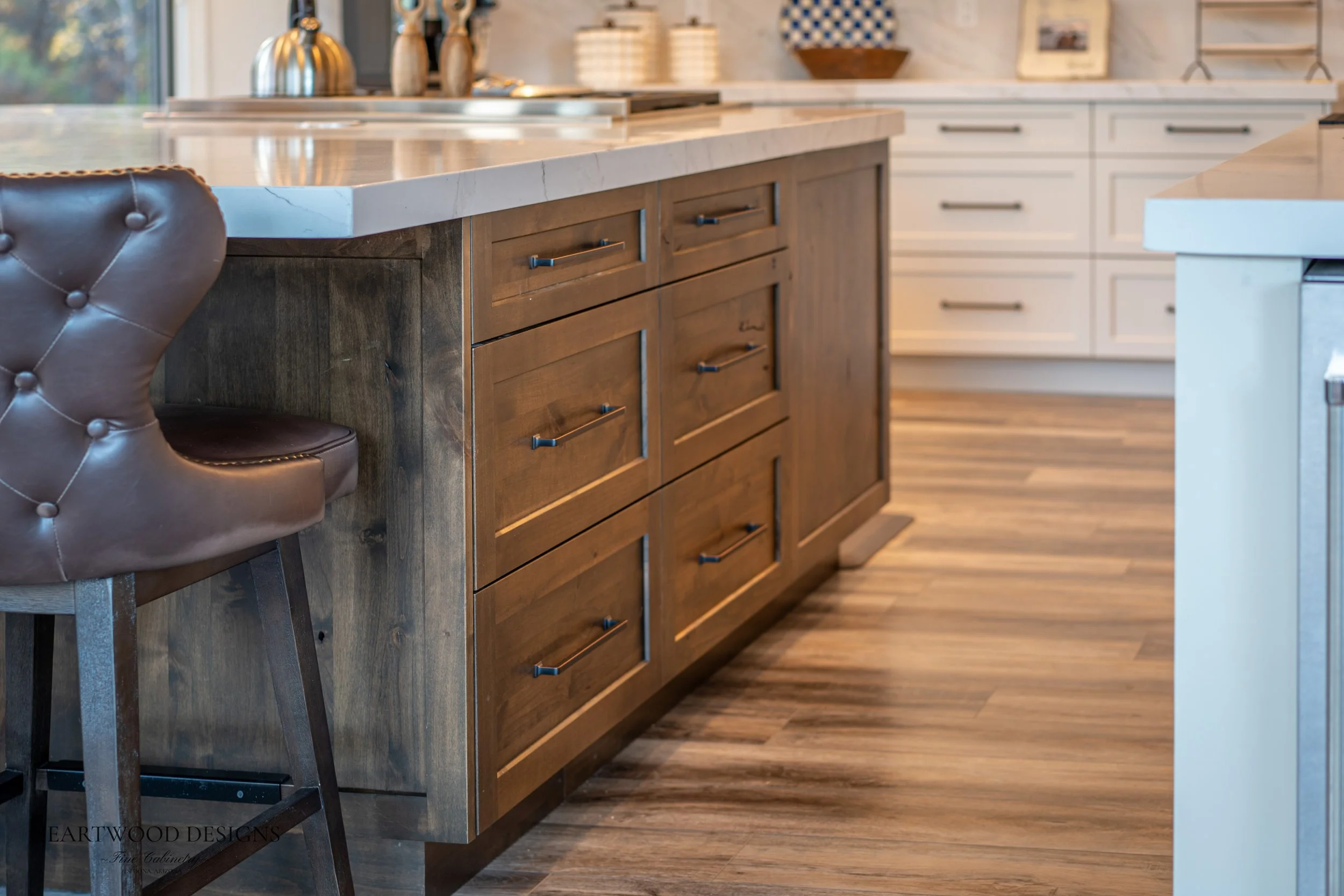 Dark stained knotty alder kitchen island with white painted shaker cabinets in Forest Highlands, Flagstaff AZ