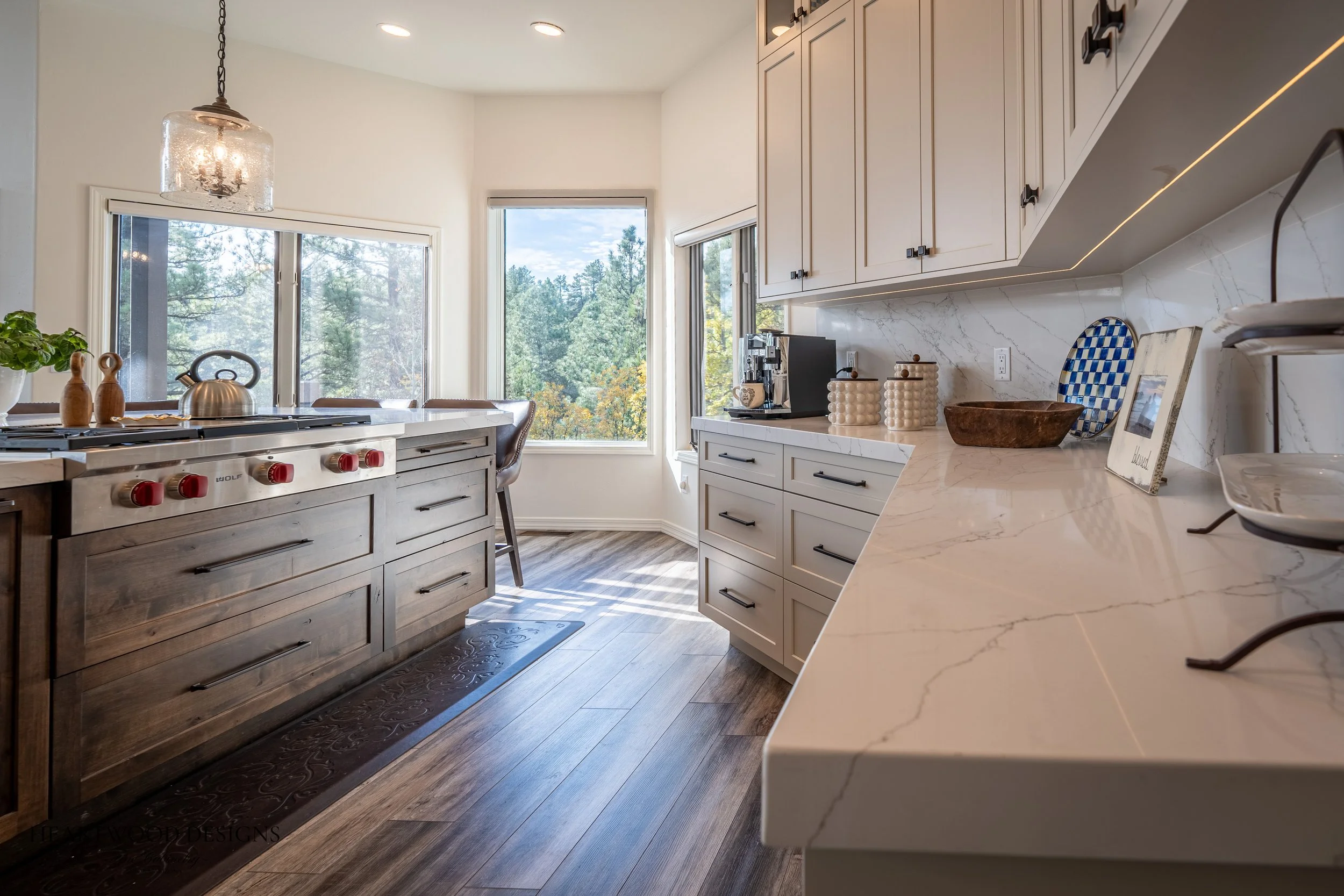 Dark stained knotty alder kitchen island with white painted shaker cabinets in Forest Highlands, Flagstaff AZ