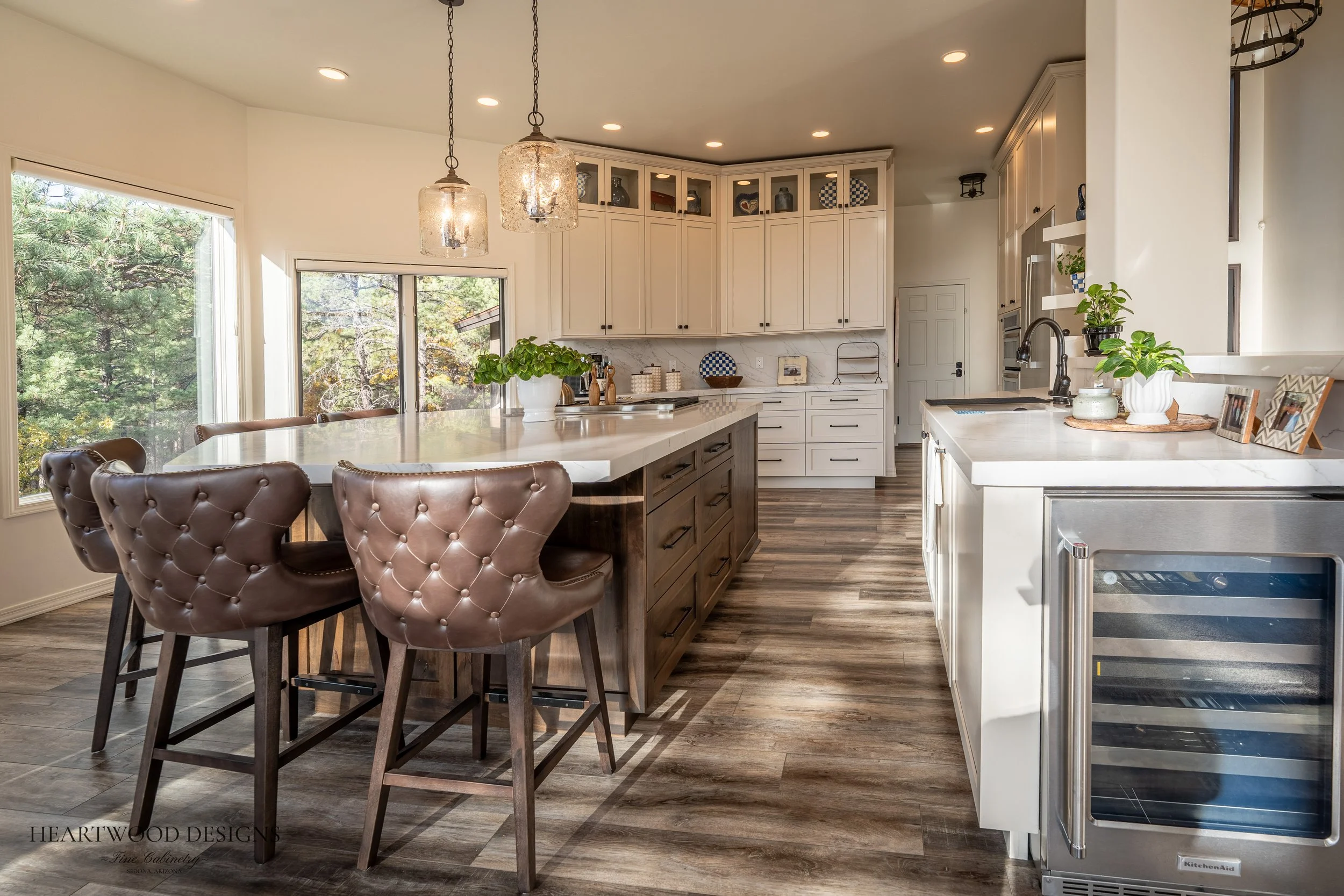 Dark stained knotty alder kitchen island with white painted shaker cabinets in Forest Highlands, Flagstaff AZ
