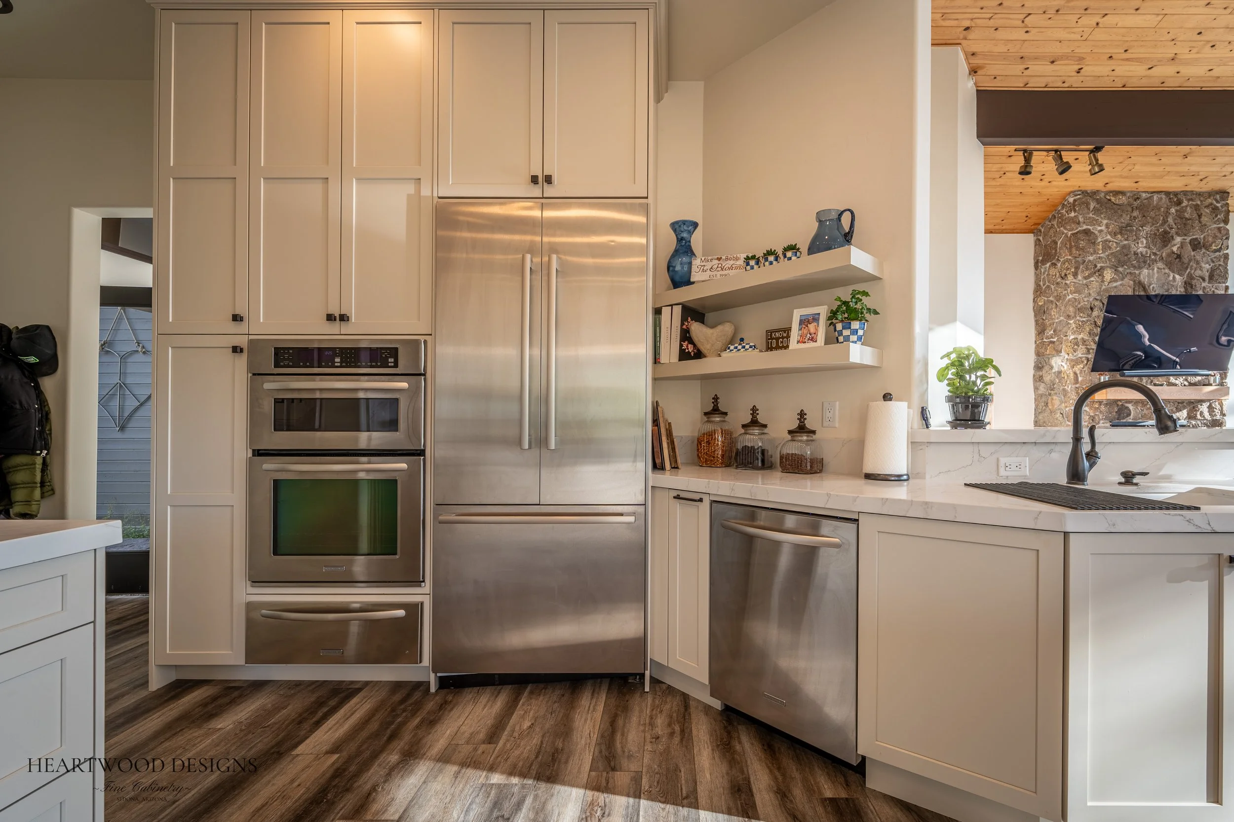 Dark stained knotty alder kitchen island with white painted shaker cabinets in Forest Highlands, Flagstaff AZ