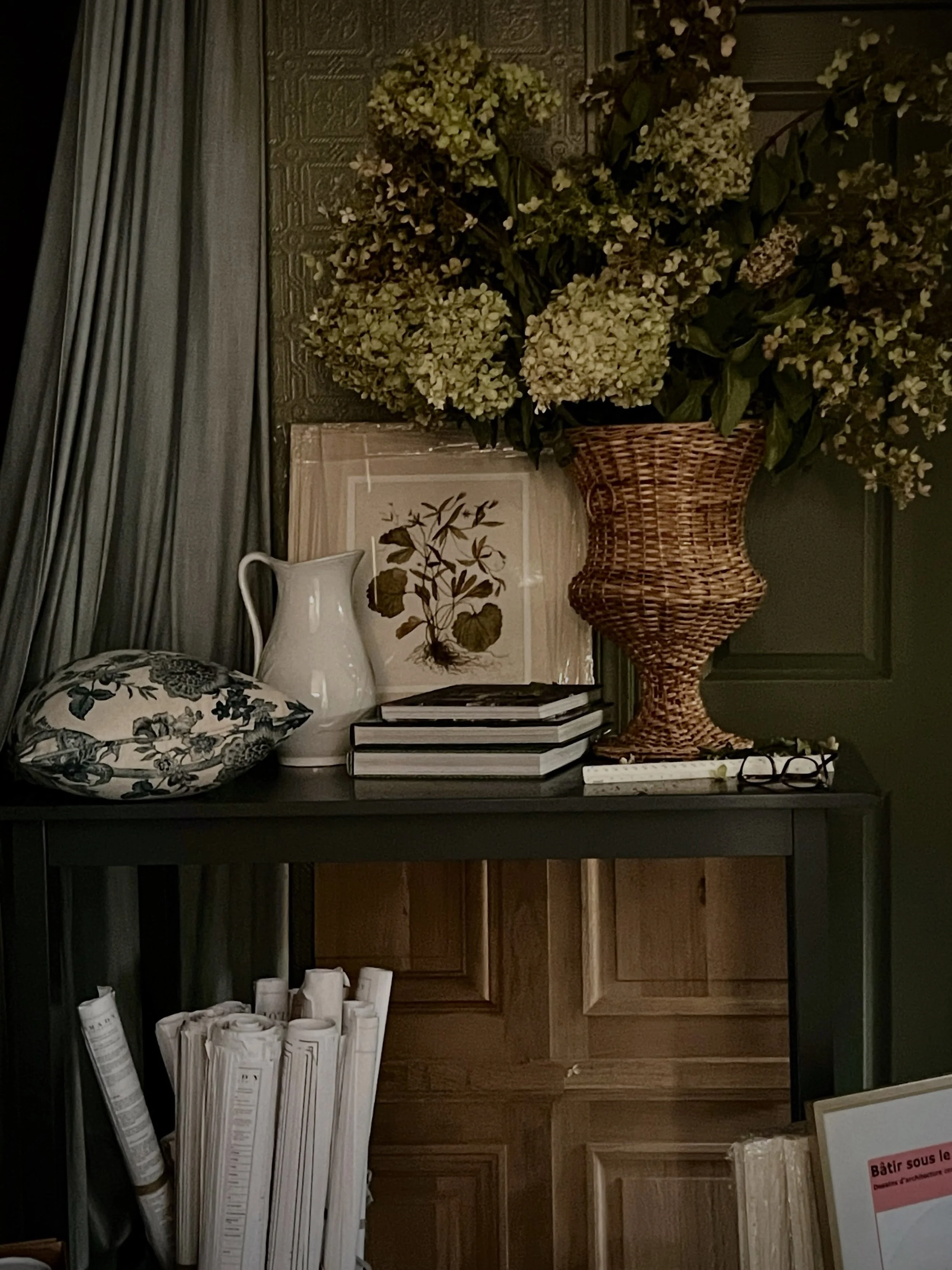 Elements from several ongoing interiors and architectural projects created this &lsquo;still life with reading glasses&rsquo;. 

Samples of boiserie, a newly framed botanical, custom pillows just arriving, books heading out to a photoshoot&hellip;a f