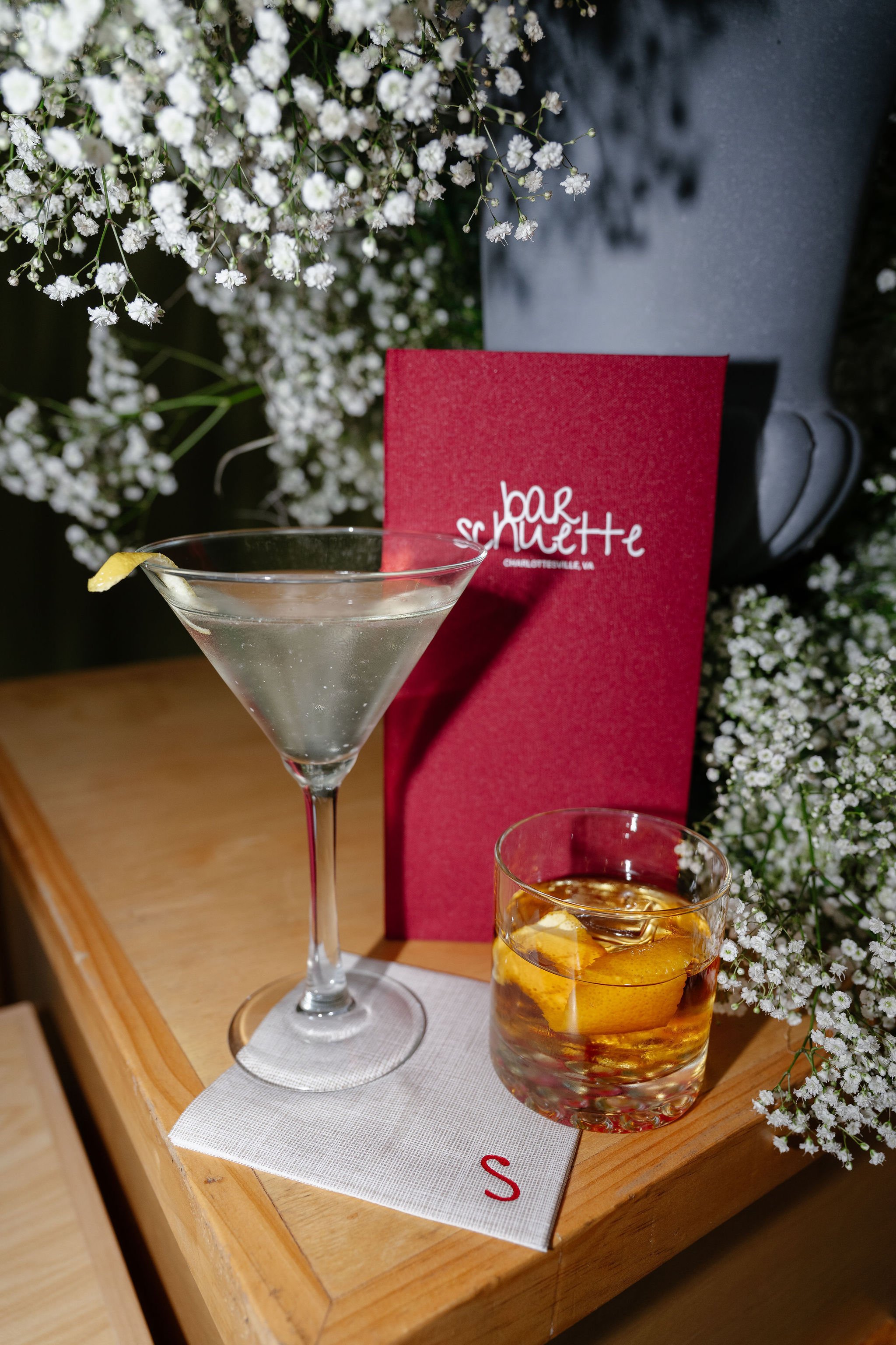 Fabric bound custom bar menu for cocktail bar themed wedding at the Clifton Inn in Charlottesville