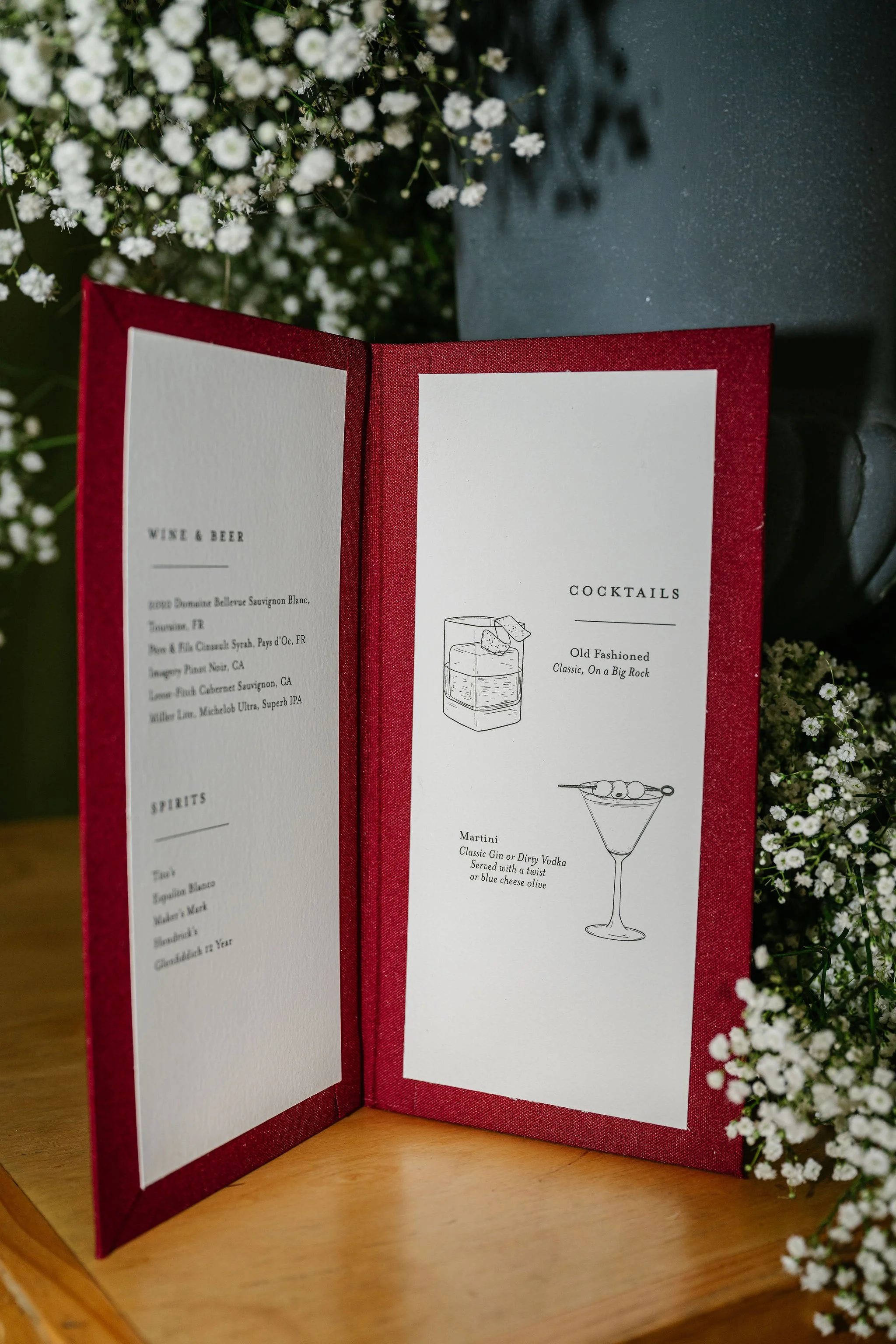 Interior of hand-illustrated Bar Schuette bar menu with custom cocktail illustrations