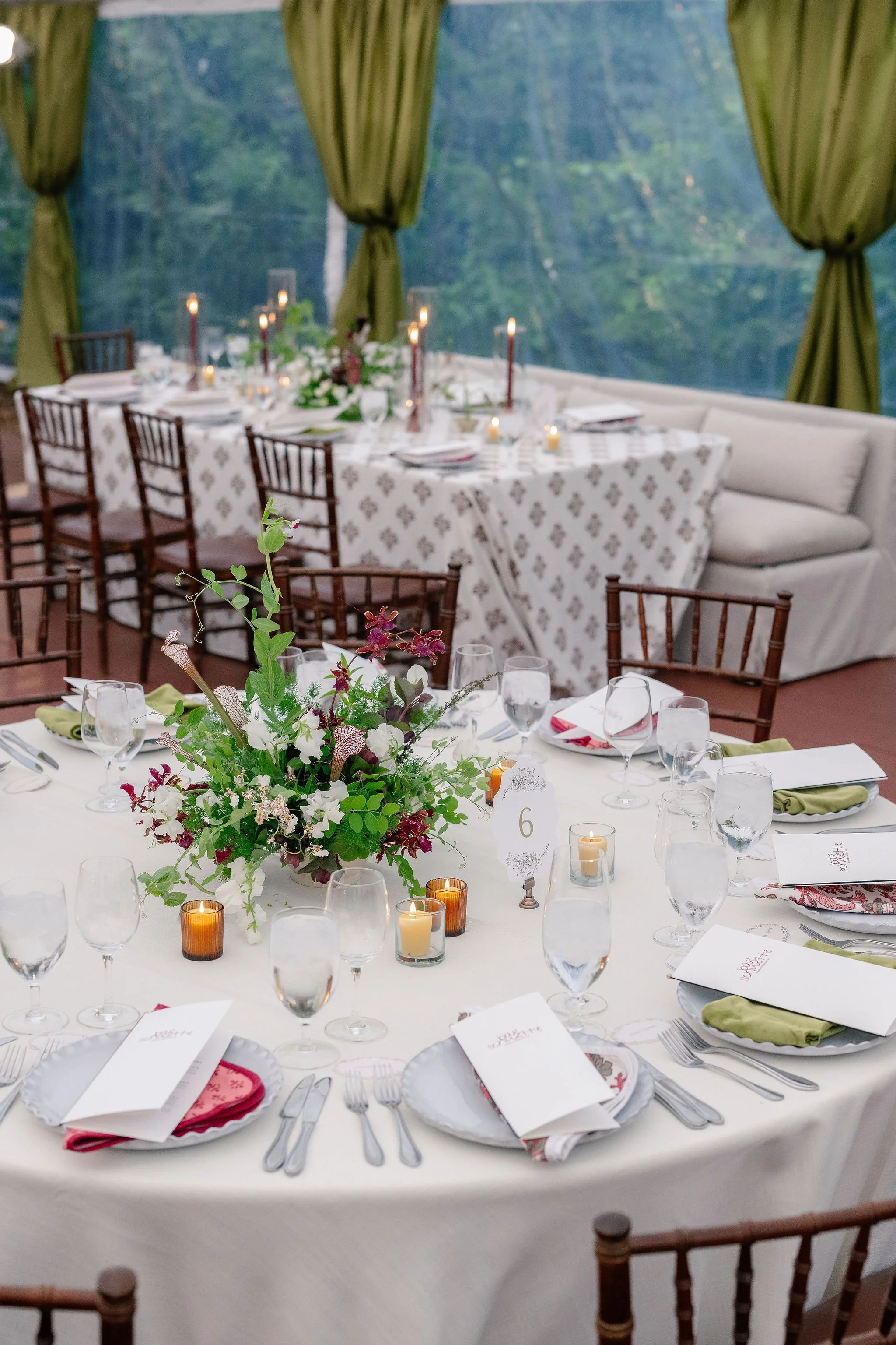 Full table setting with personalized dinner menus and baby's breath table numbers at the Clifton Inn