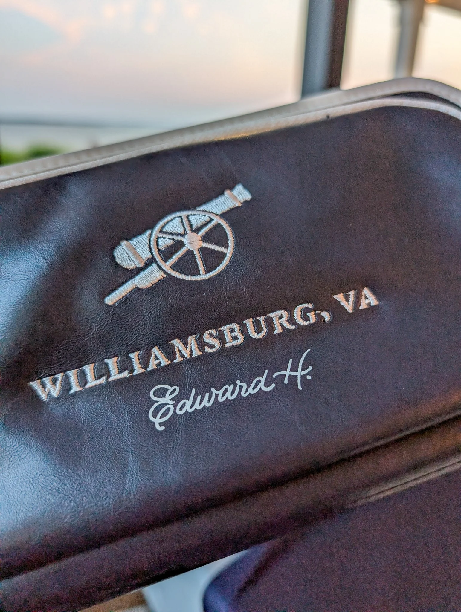 Close-up of freehand foil lettering on a golf accessory