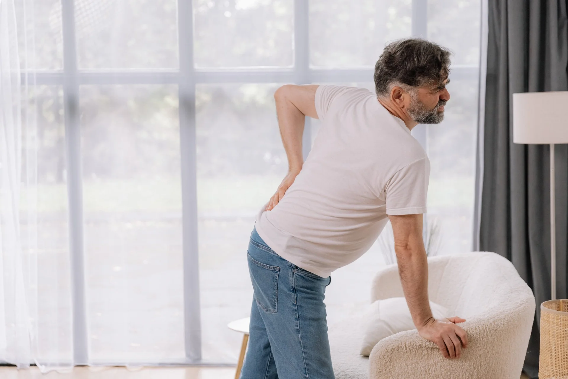 Senior man with sciatica pain.