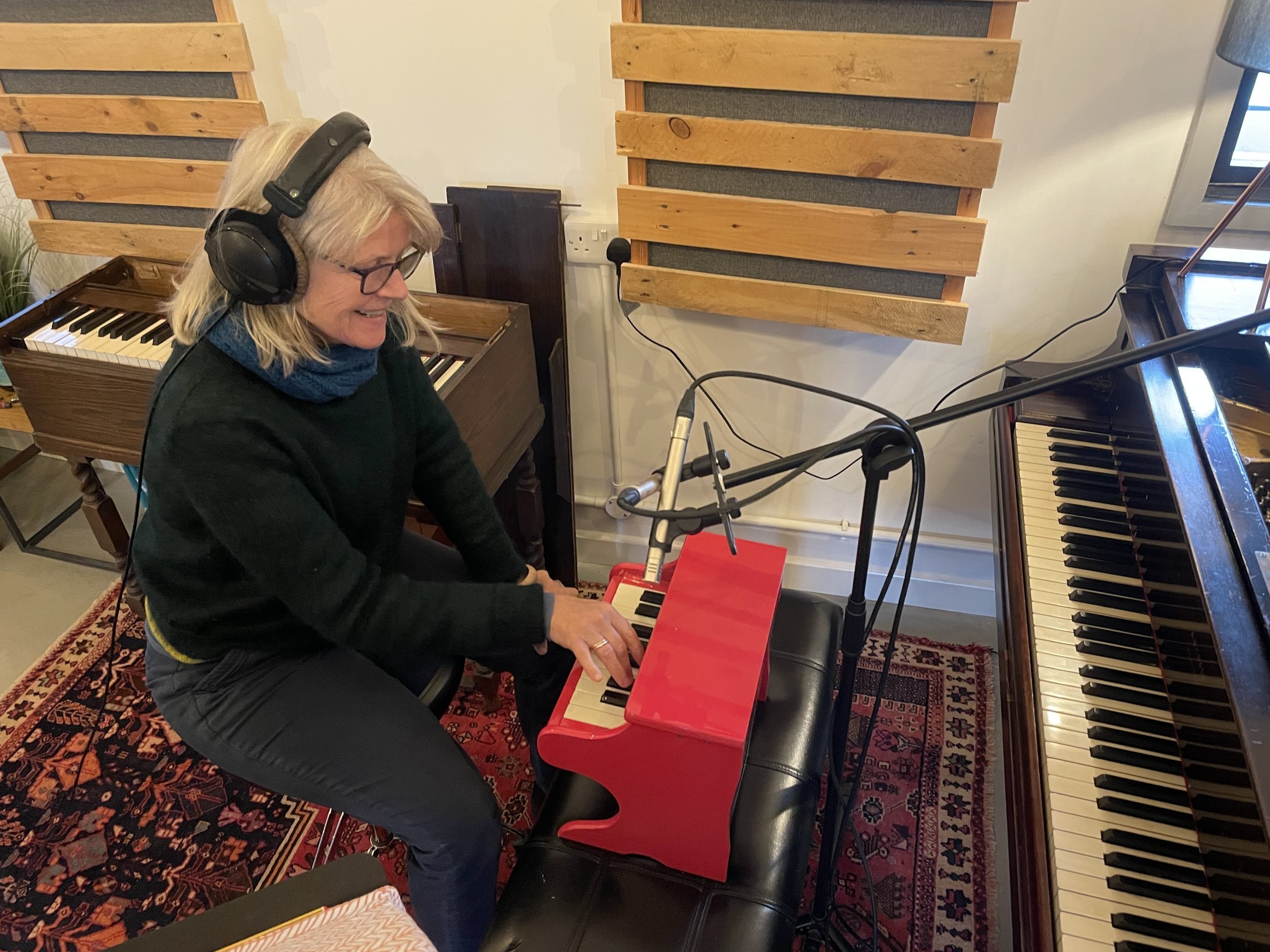 Carol Fieldhouse playing the toy piano