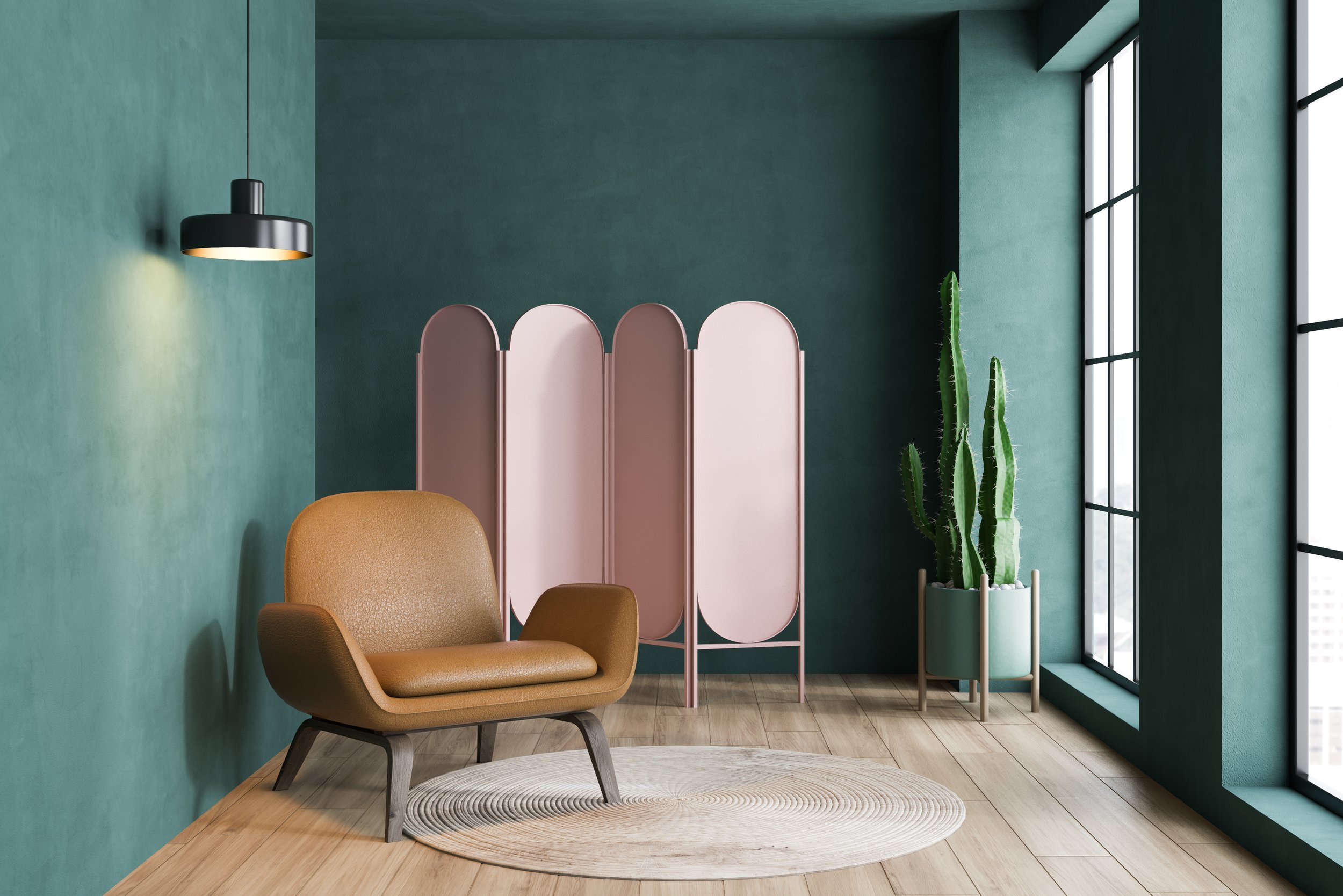 A very modern dark green living room with a light brown armchair and pink folding screen behind it.