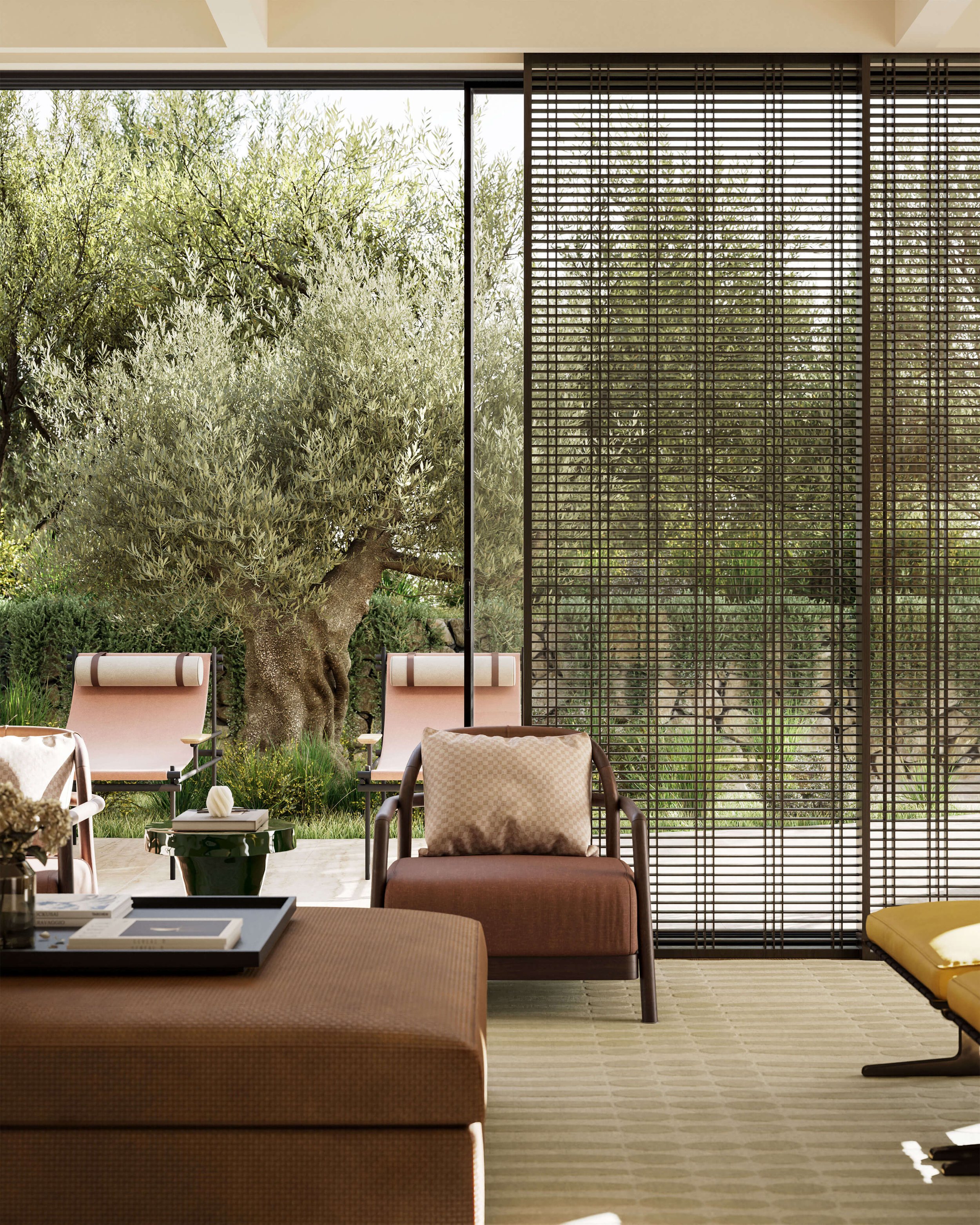 family living area with relaxed armchair, upholstered coffee table and view onto landscaped terrace
