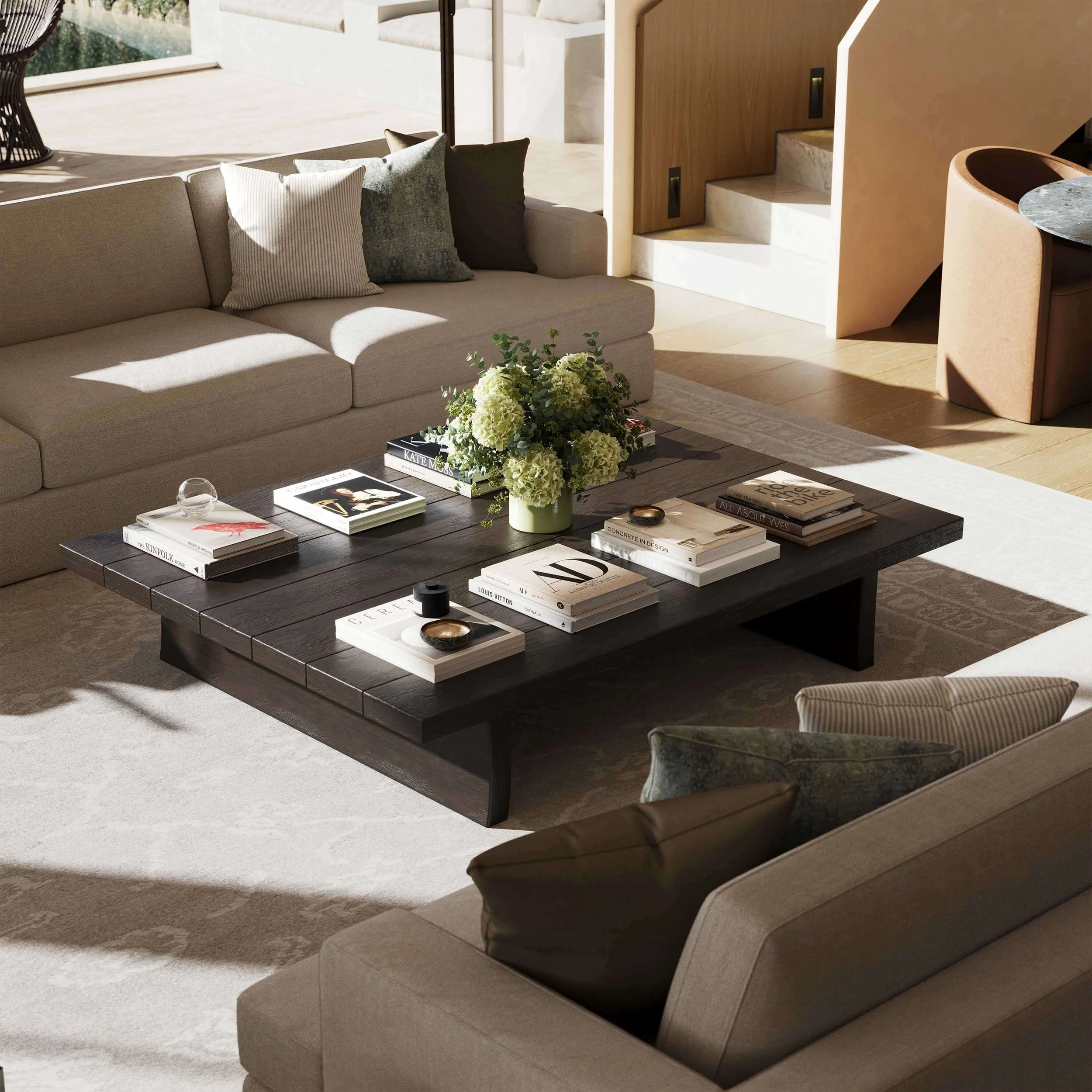 coffee table with books styled on top and flowers