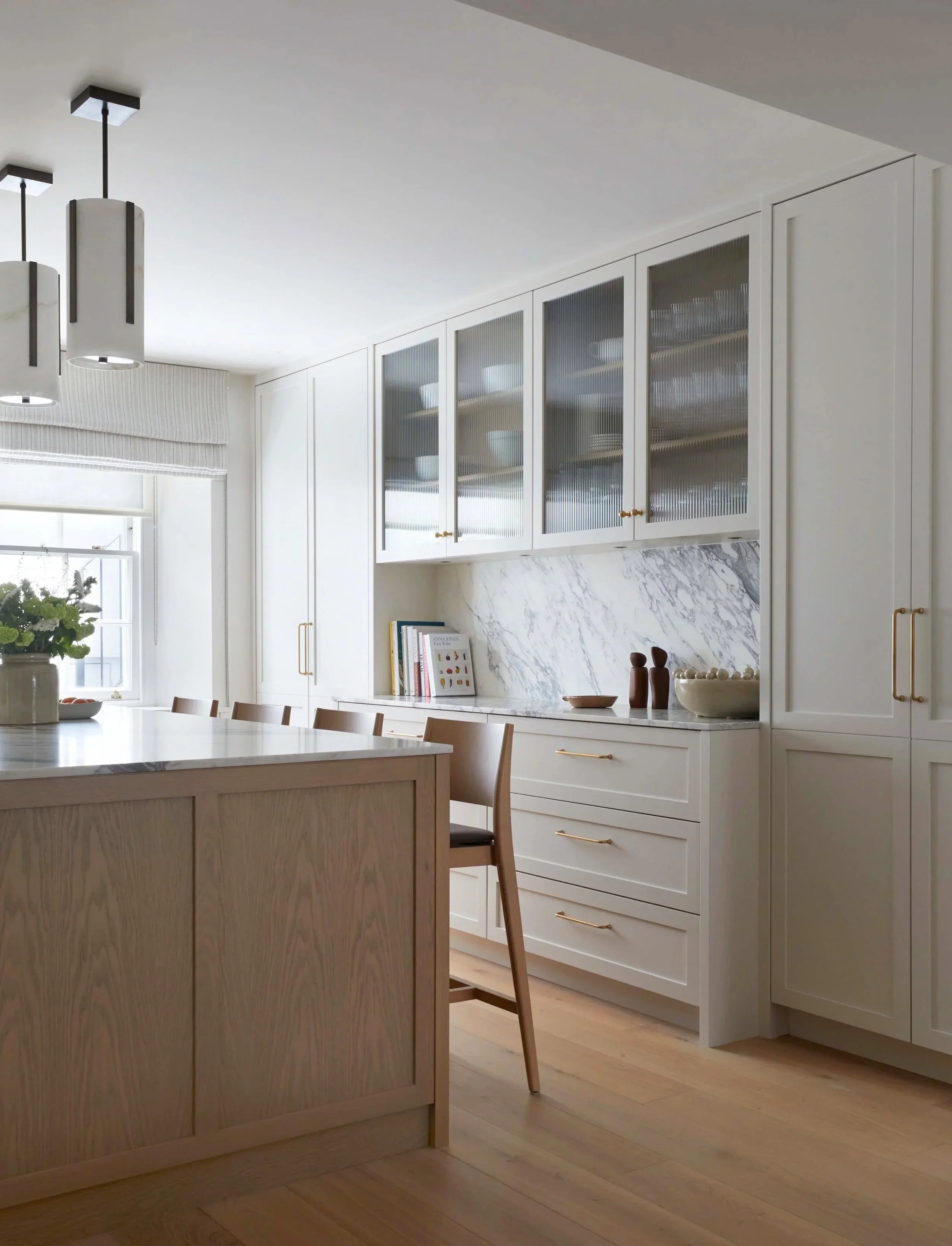 contemporary high end kitchen with marble and oak finishes