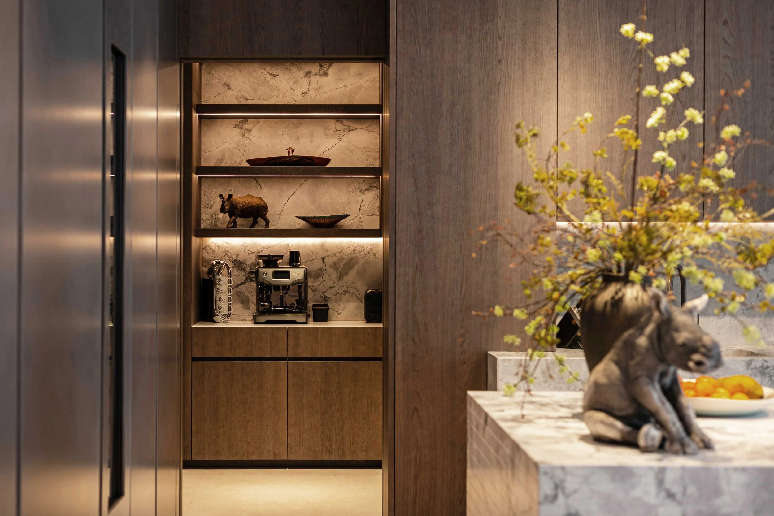contemporary kitchen with dark wood timber, marble backsplash and kitchen shelving