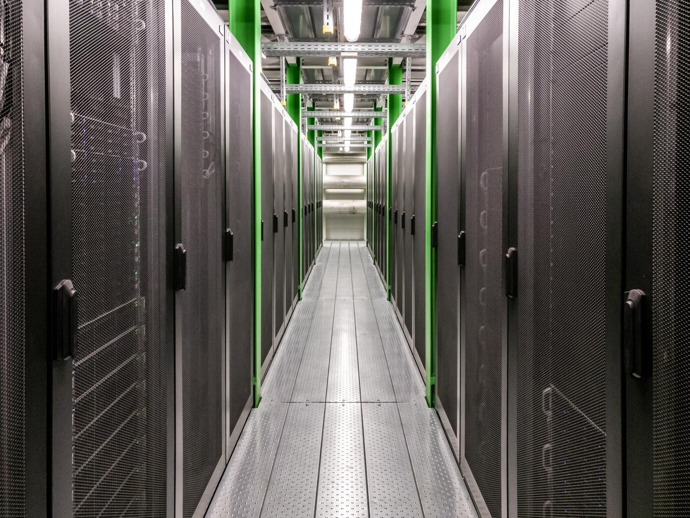 Data center hallway with server racks- Equipment Brokerage Partners