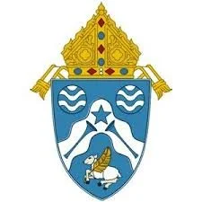 A coat of arms with a crown on top, featuring a shield divided into sections with water waves, a star, and a lobster.