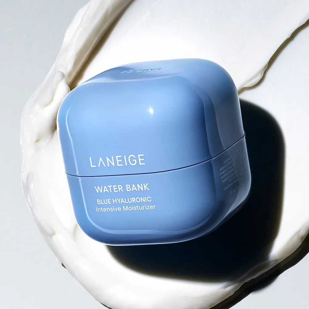 Blue Laneige Water Bank Blue Hyaluronic Intensive Moisturizer container with a shiny finish, placed on a white creamy surface.