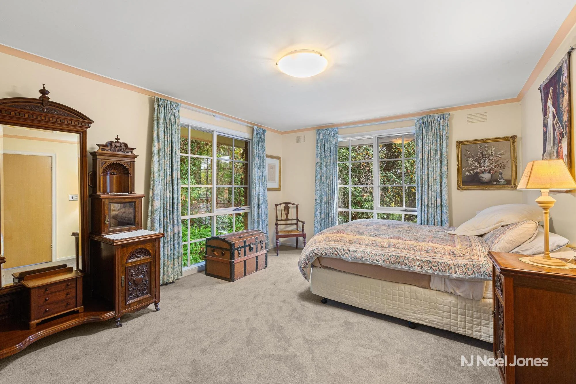 Luxurious king-size master bedroom with private ensuite and walk-in wardrobe at 9 Faull Close Croydon North, providing peaceful retreat with quality finishes and abundant natural light