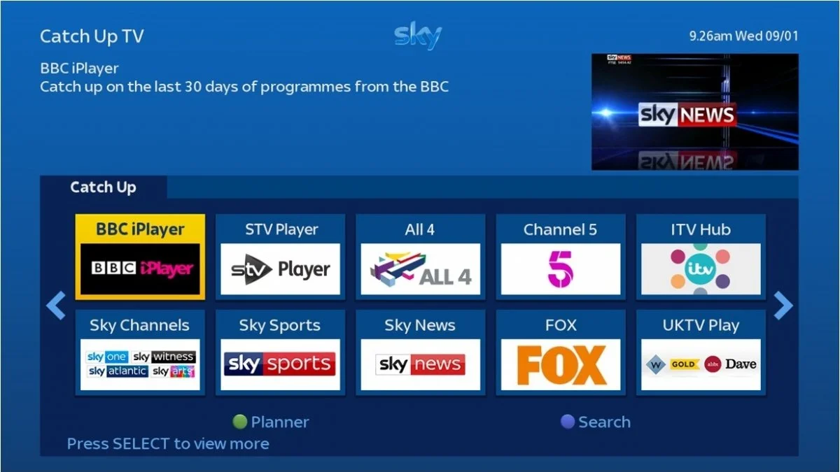 Menu screen showing a selection of TV channels and streaming options on Sky TV, including BBC iPlayer, STV Player, All 4, Channel 5, ITV Hub, Sky Channels, Sky Sports, Sky News, FOX, and UKTV Play, with a small TV news logo in the upper right corner.